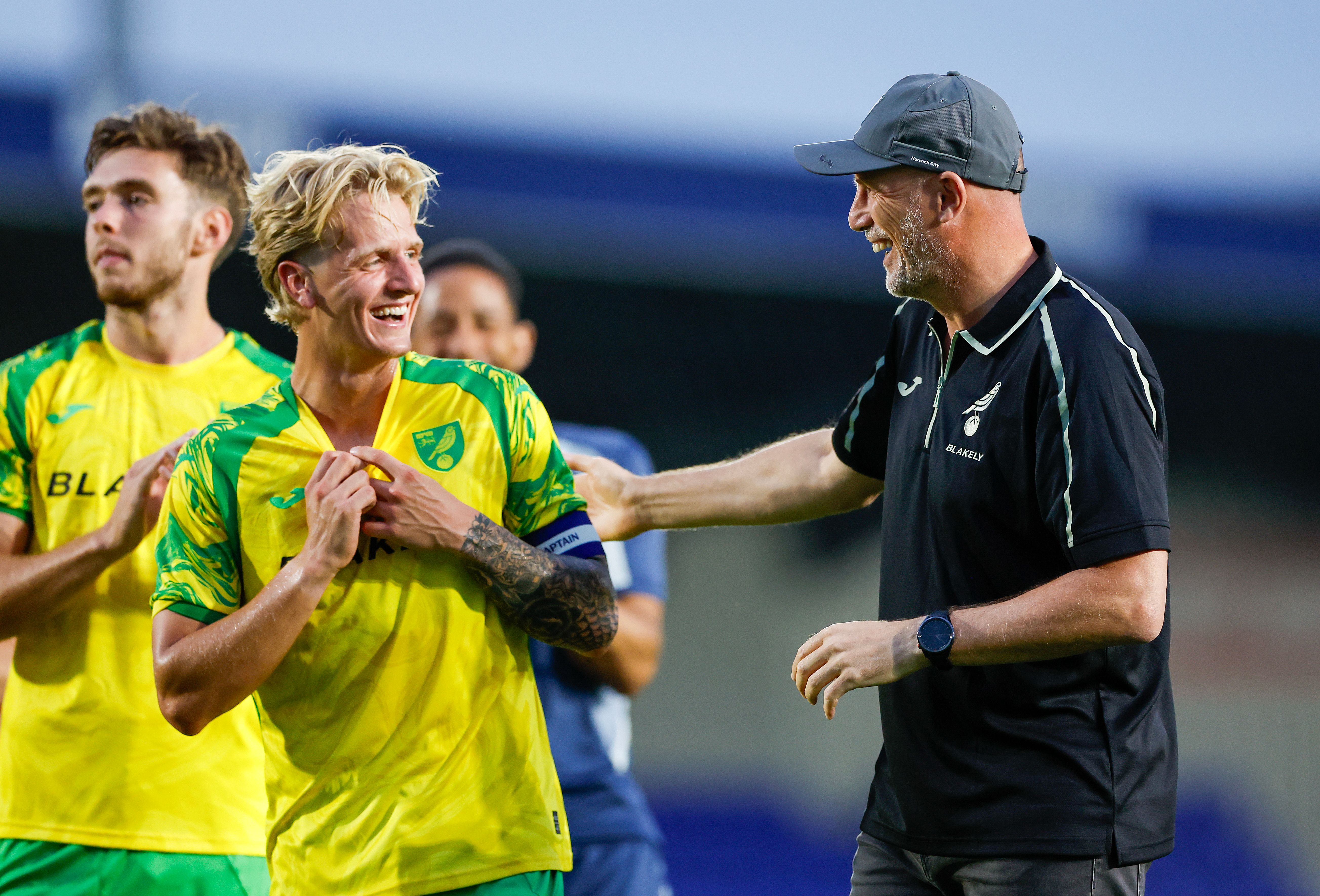 Pelle Mattsson with Norwich manager Philippe Clement laughing after a game 