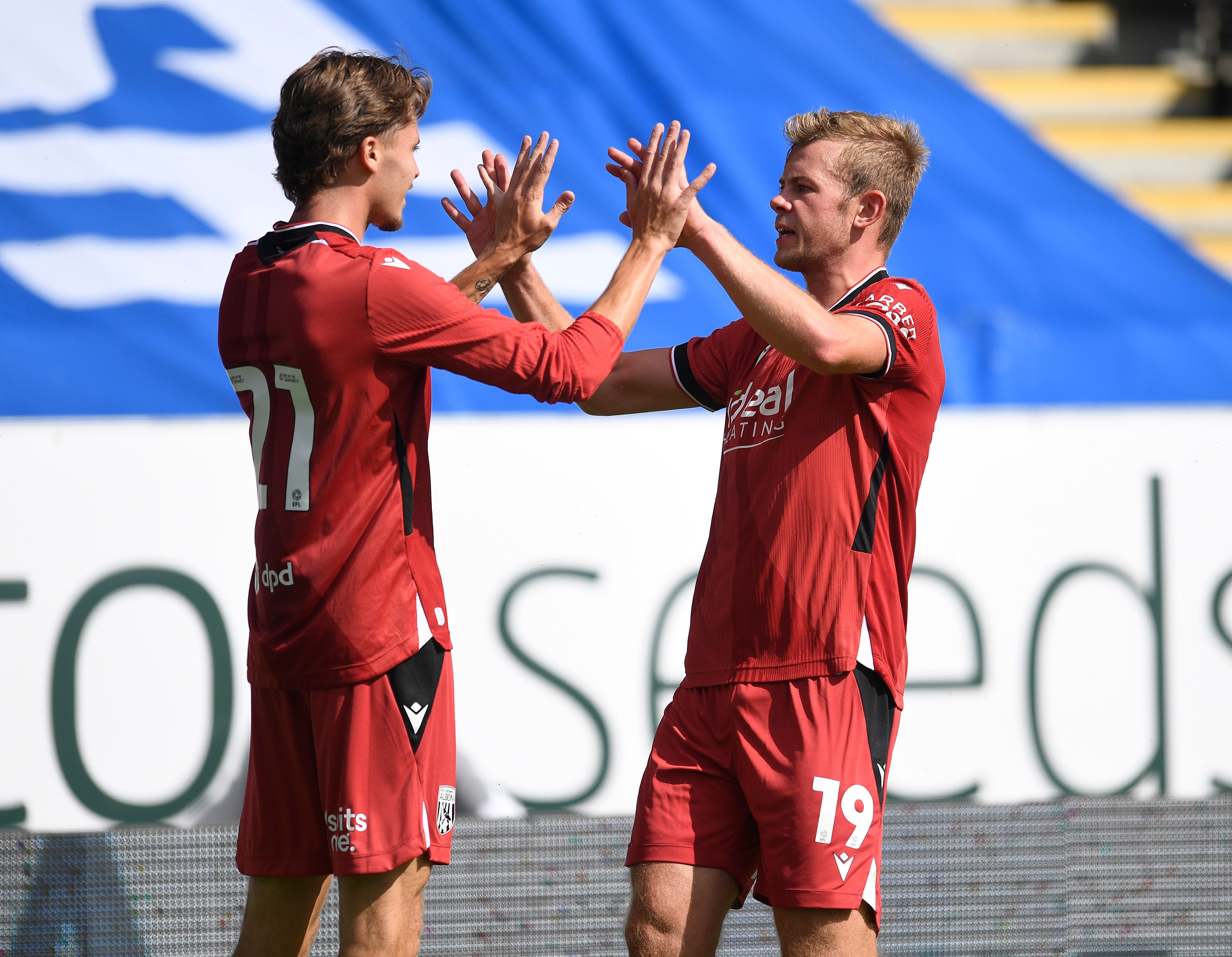 Aune Heggebø celebrates scoring against Peterborough with Isaac Price 
