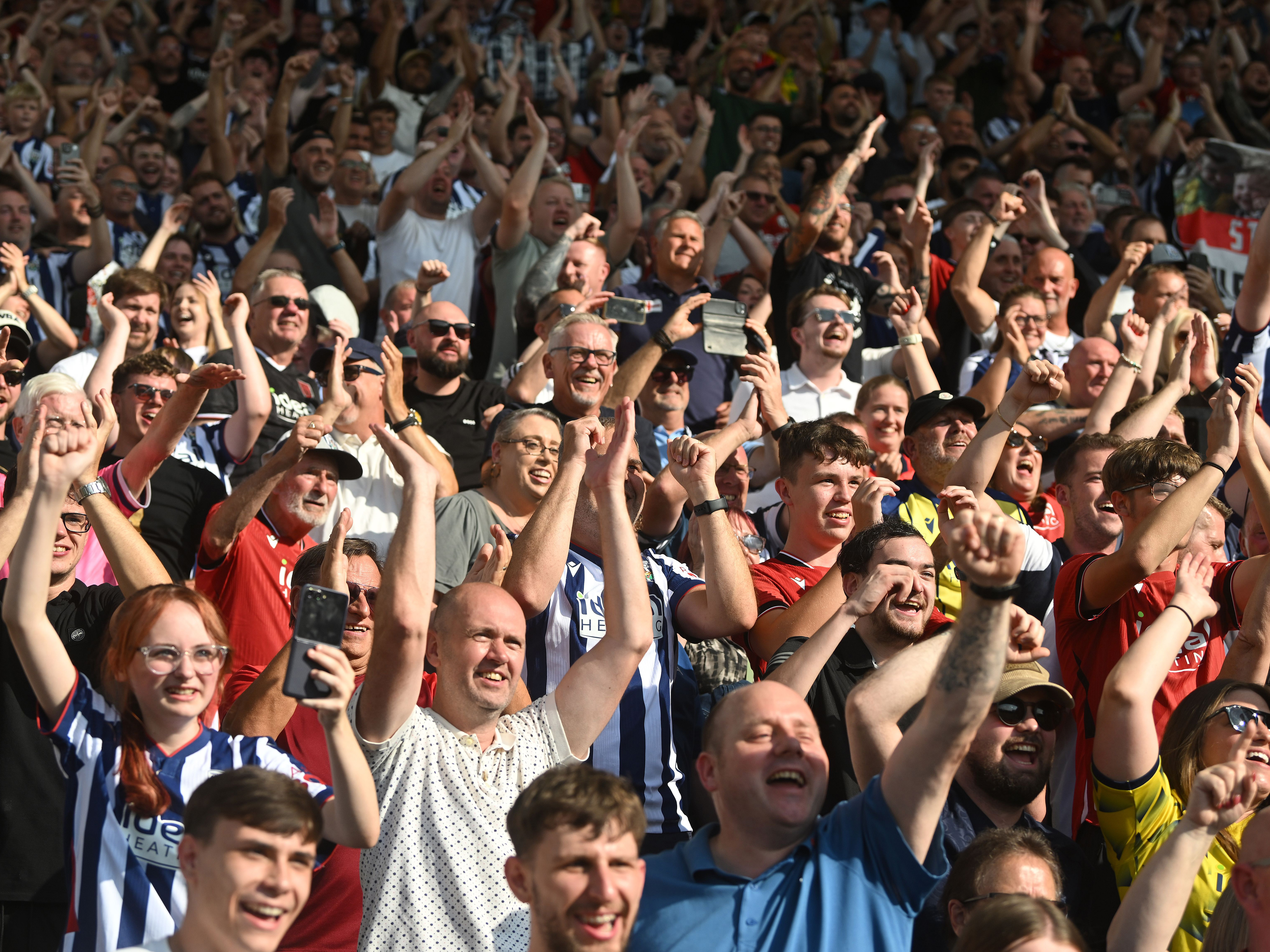 WBA fans cheering at a game