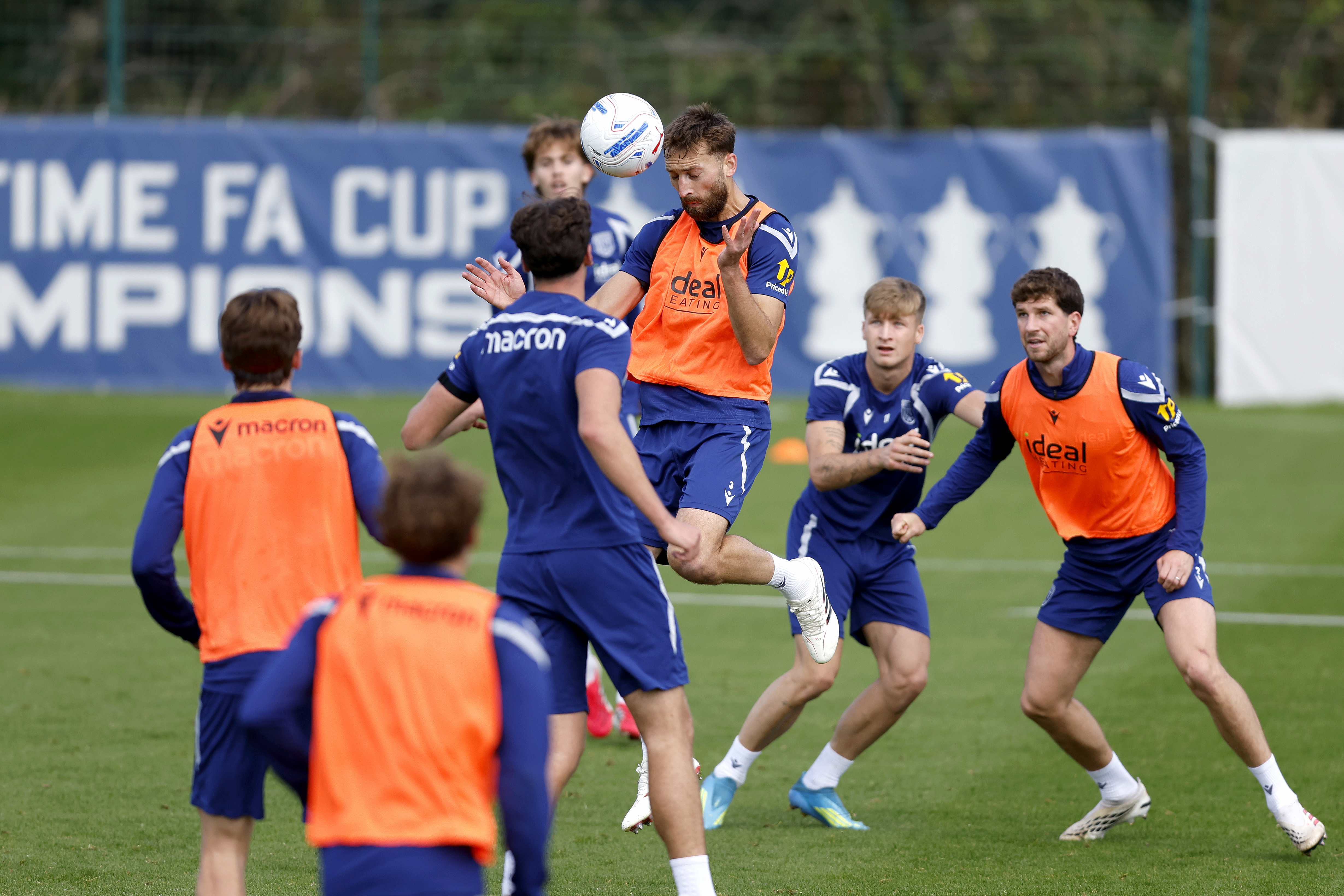 Nat Phillips heading the ball away during a training session