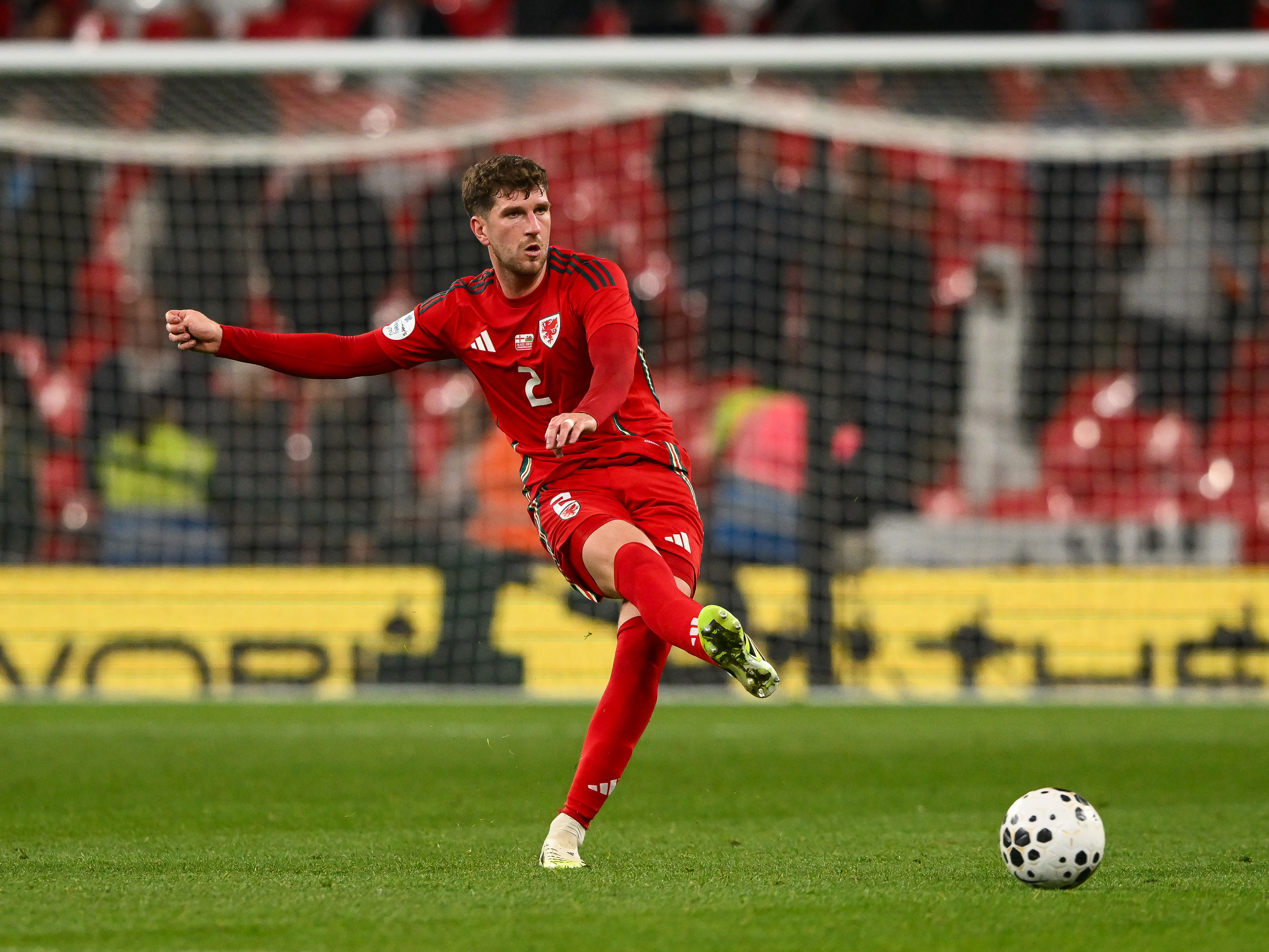 Chris Mepham in action for Wales.