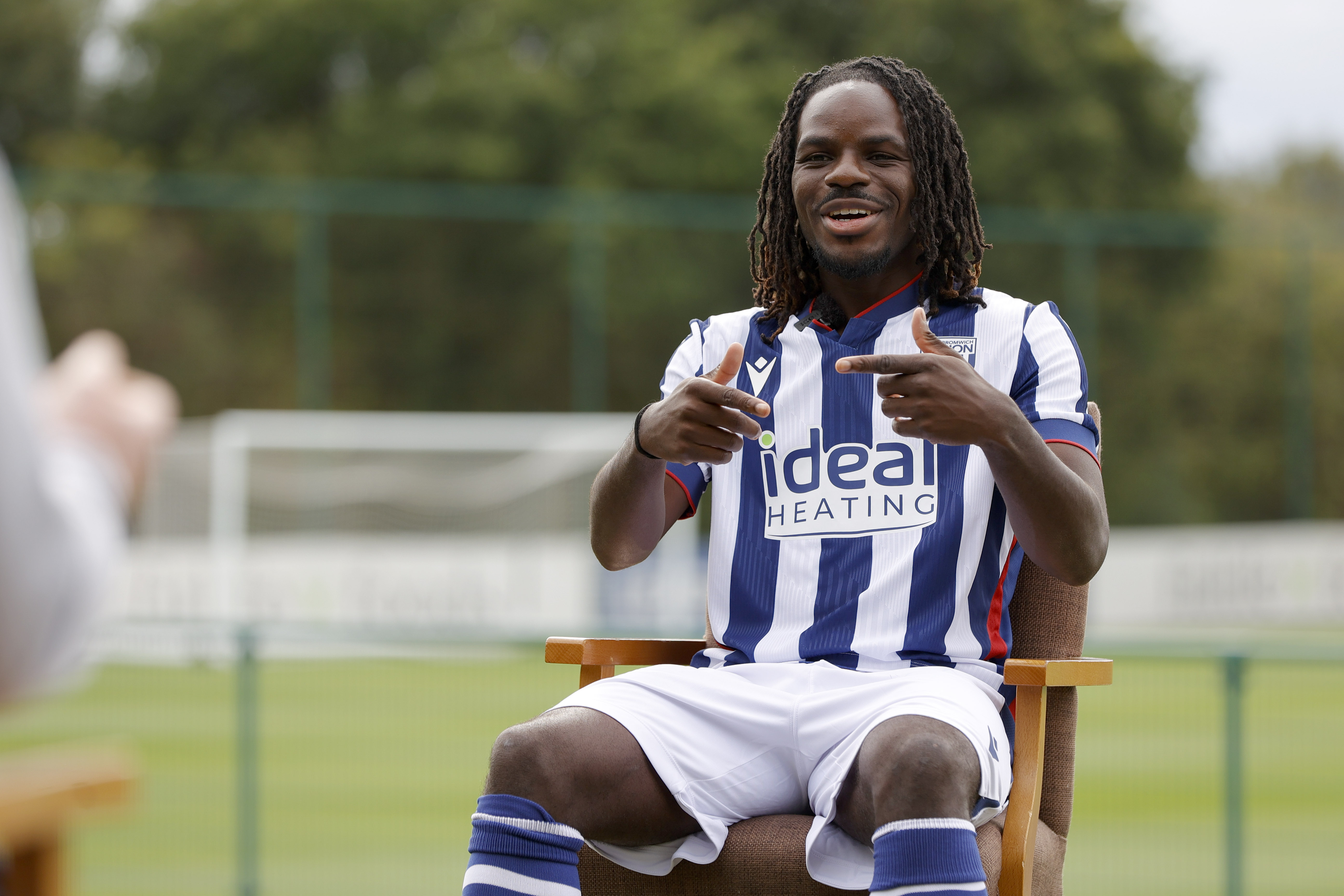Brayann Pereira is interviewed by WBA TV while sat in the home kit 