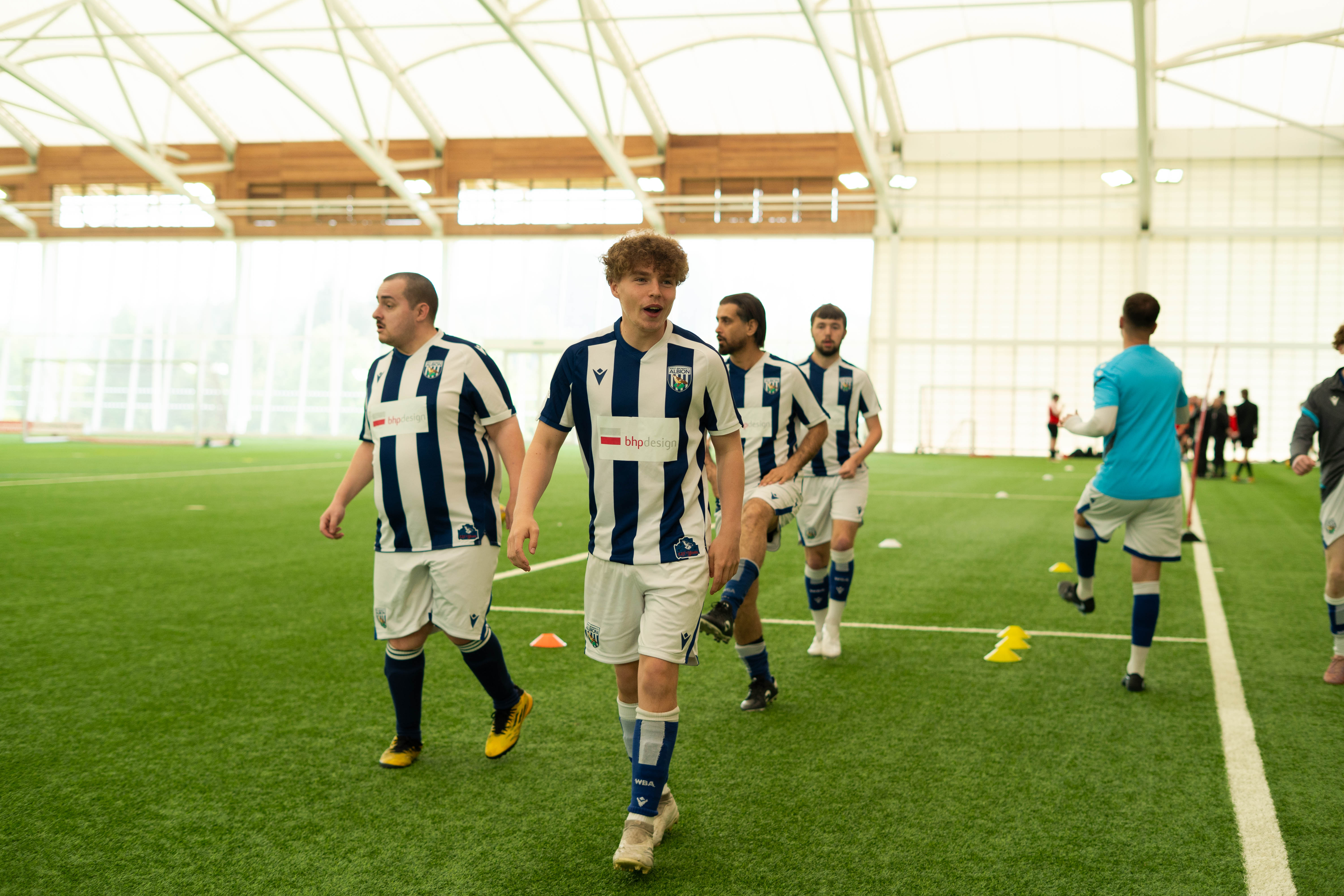 Four WBA CP Players walking on the pitch