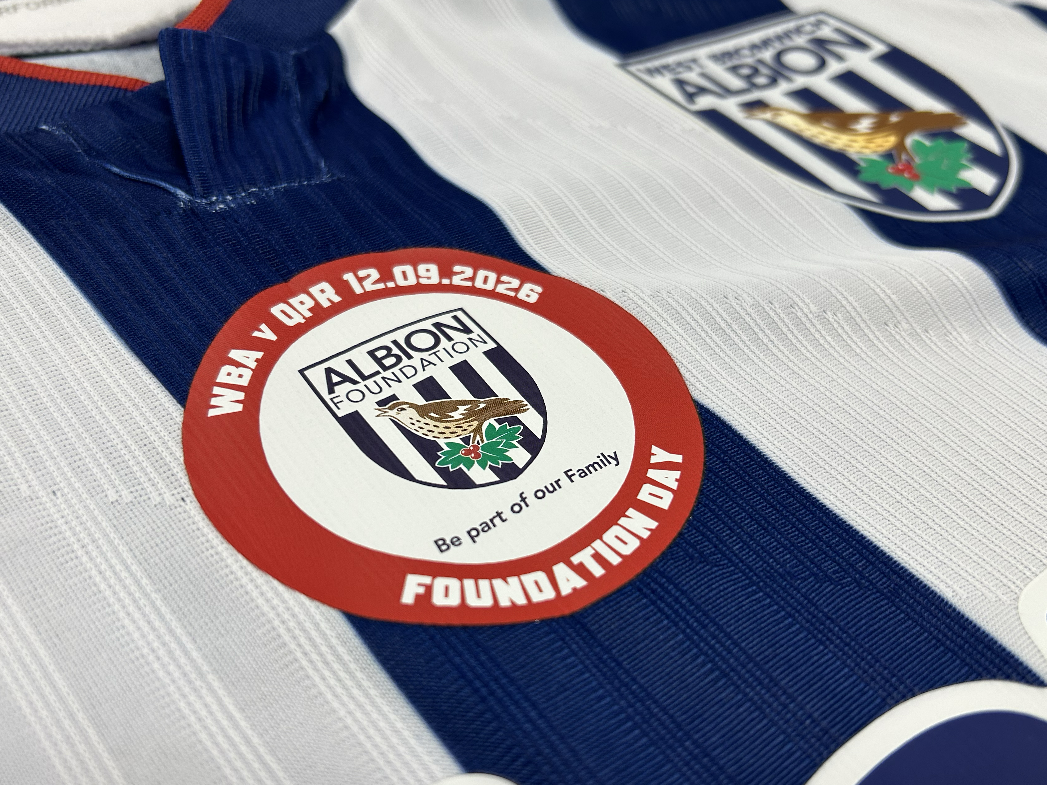 An image of the Albion Foundation badge on a home shirt