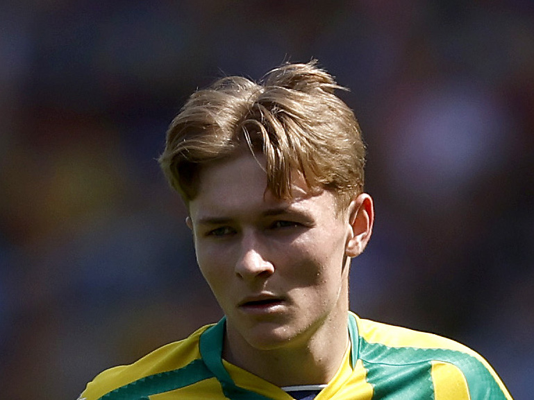 A close-up shot of Ollie Bostock's face