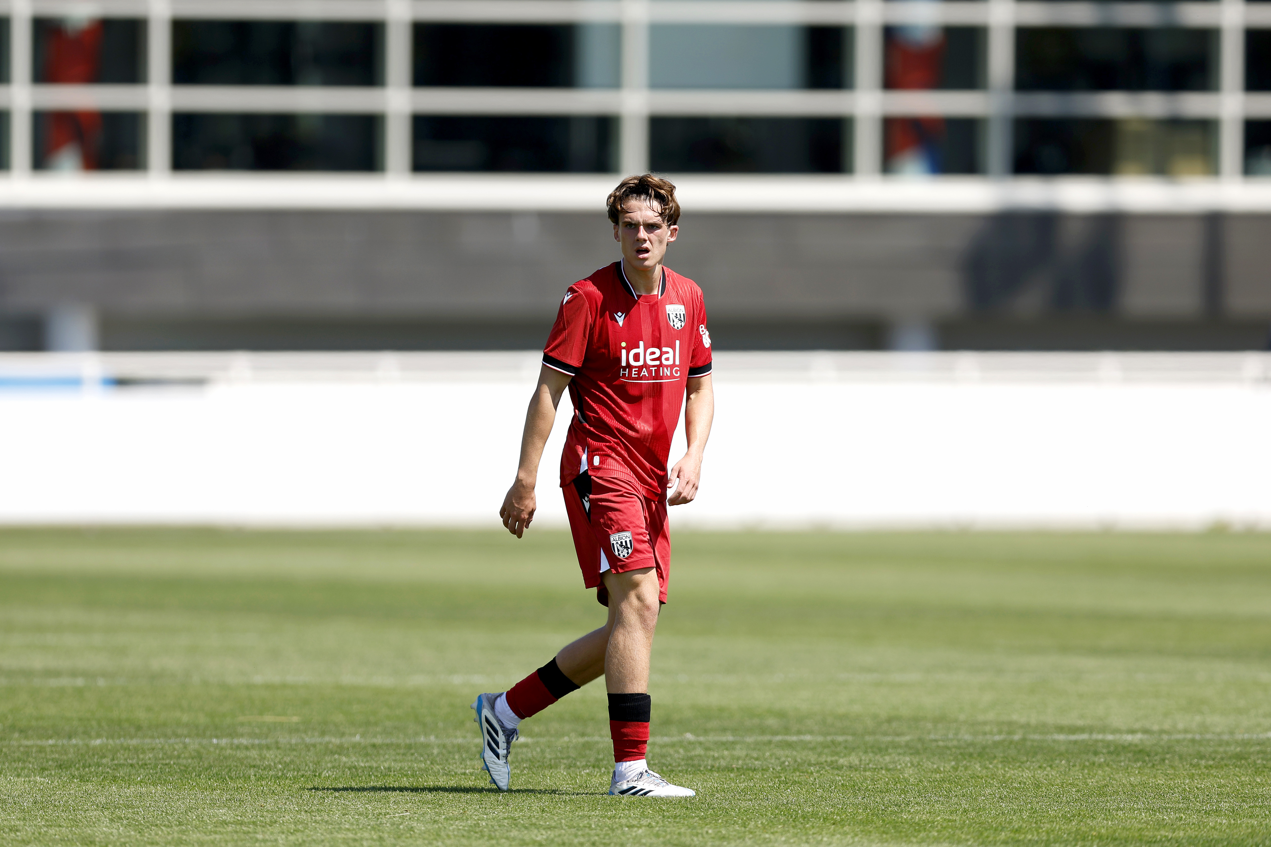 Matt Crowther in action for WBA in the red kit 