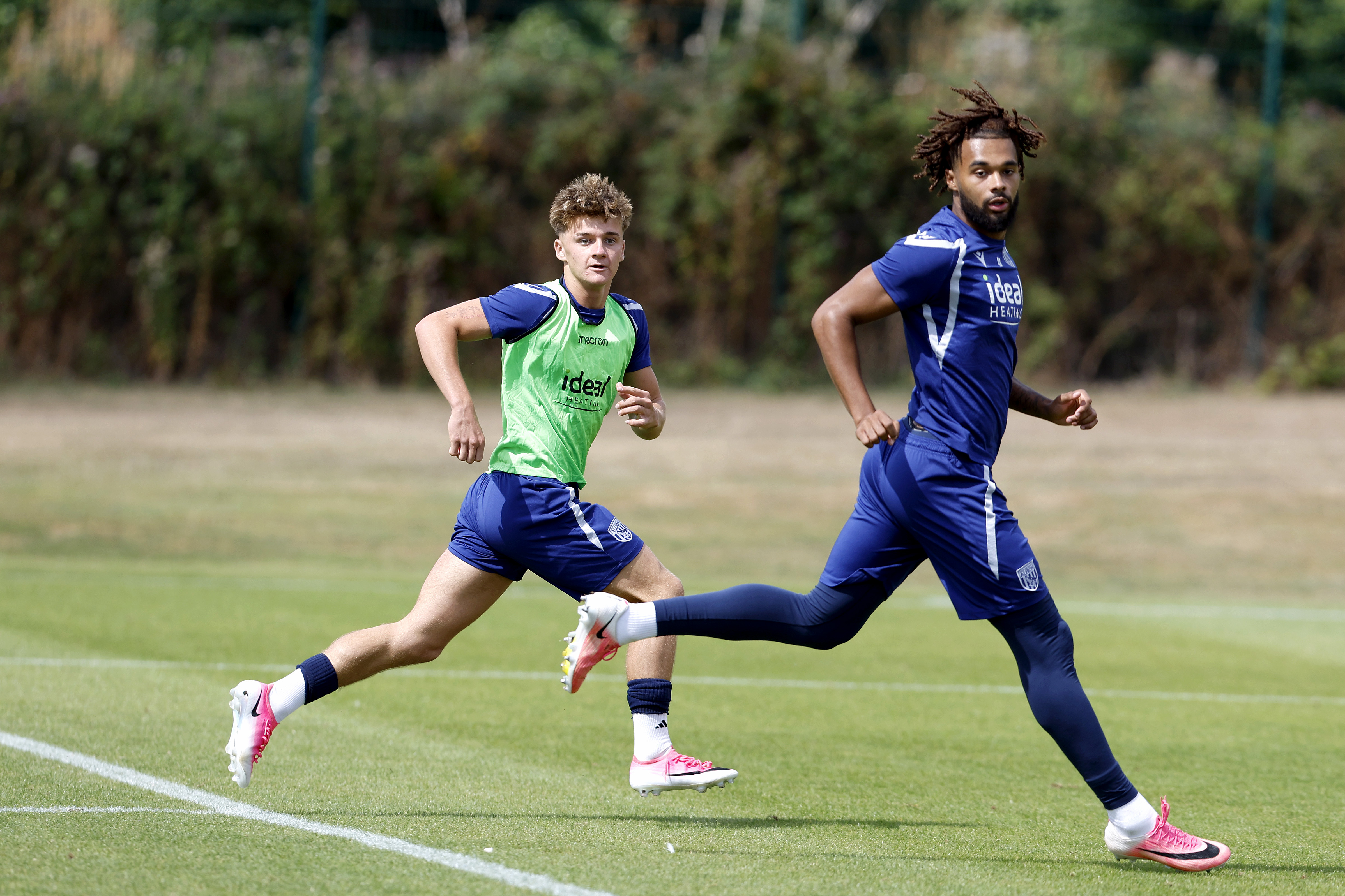 Harry French and Jamal Mohammed looking for the ball during an U21 training session