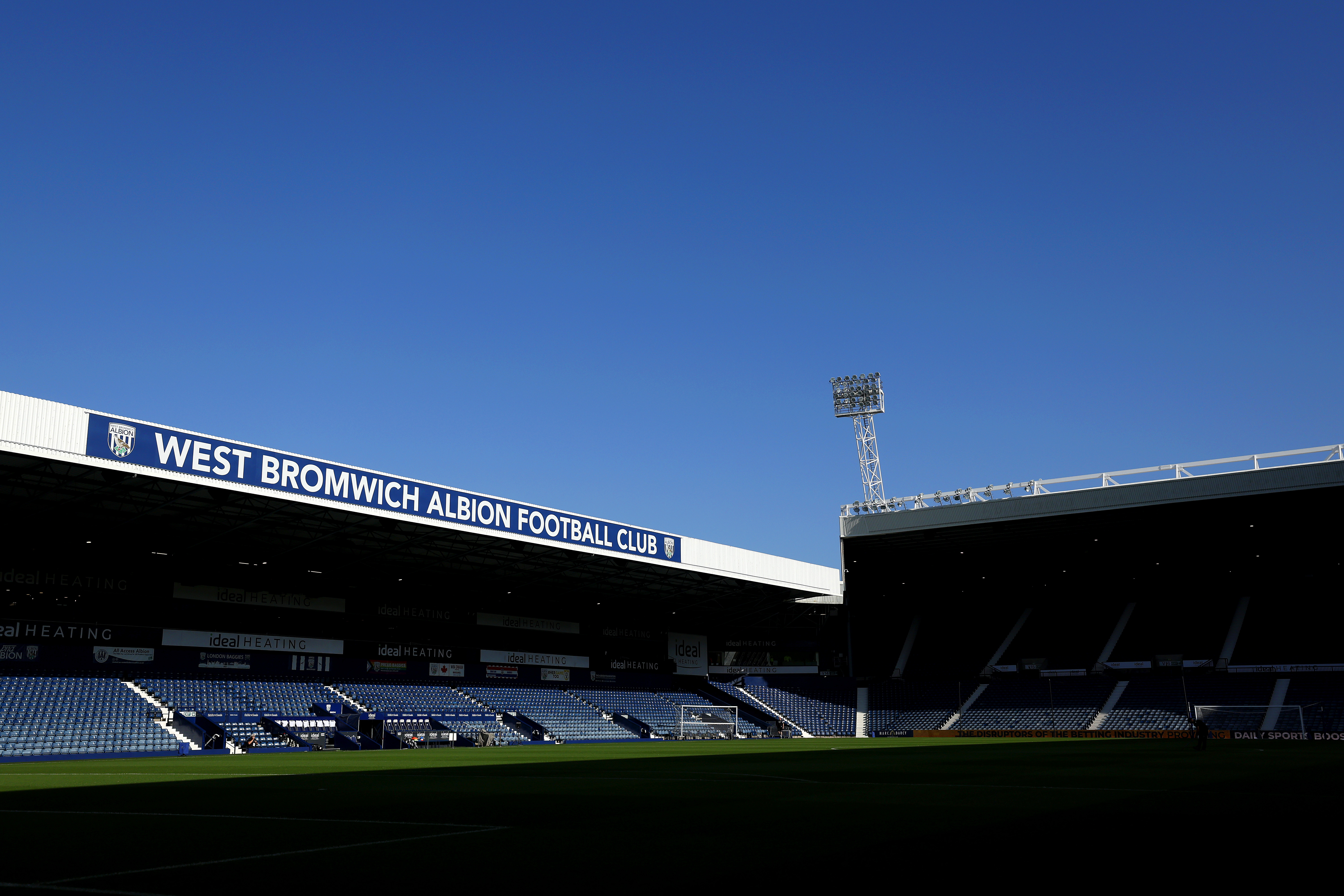 A general view of the West Stand at The Hawthorns with blue sky above 