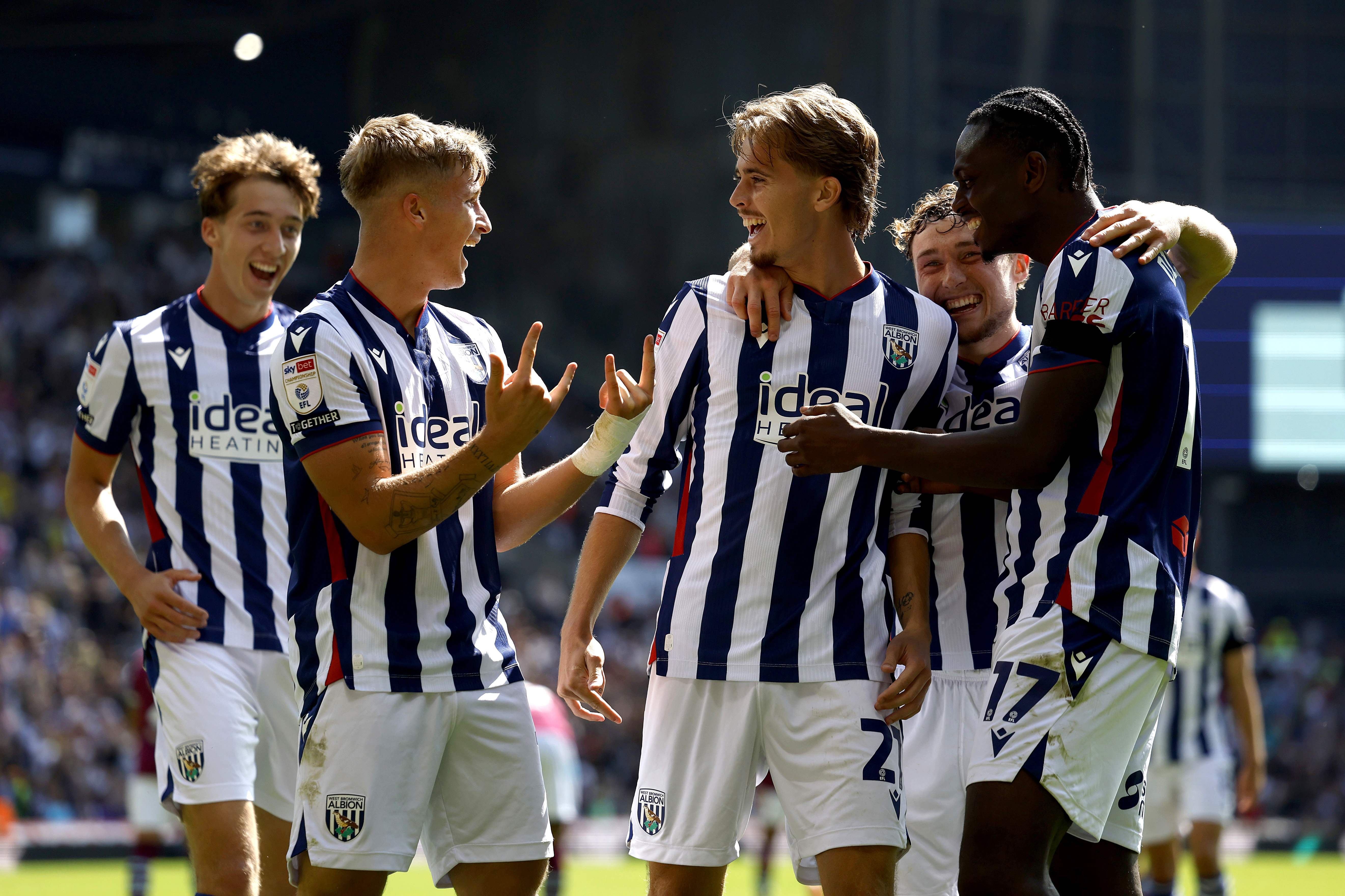 Isaac Price celebrates scoring against Burnley with team-mates in the home kit 