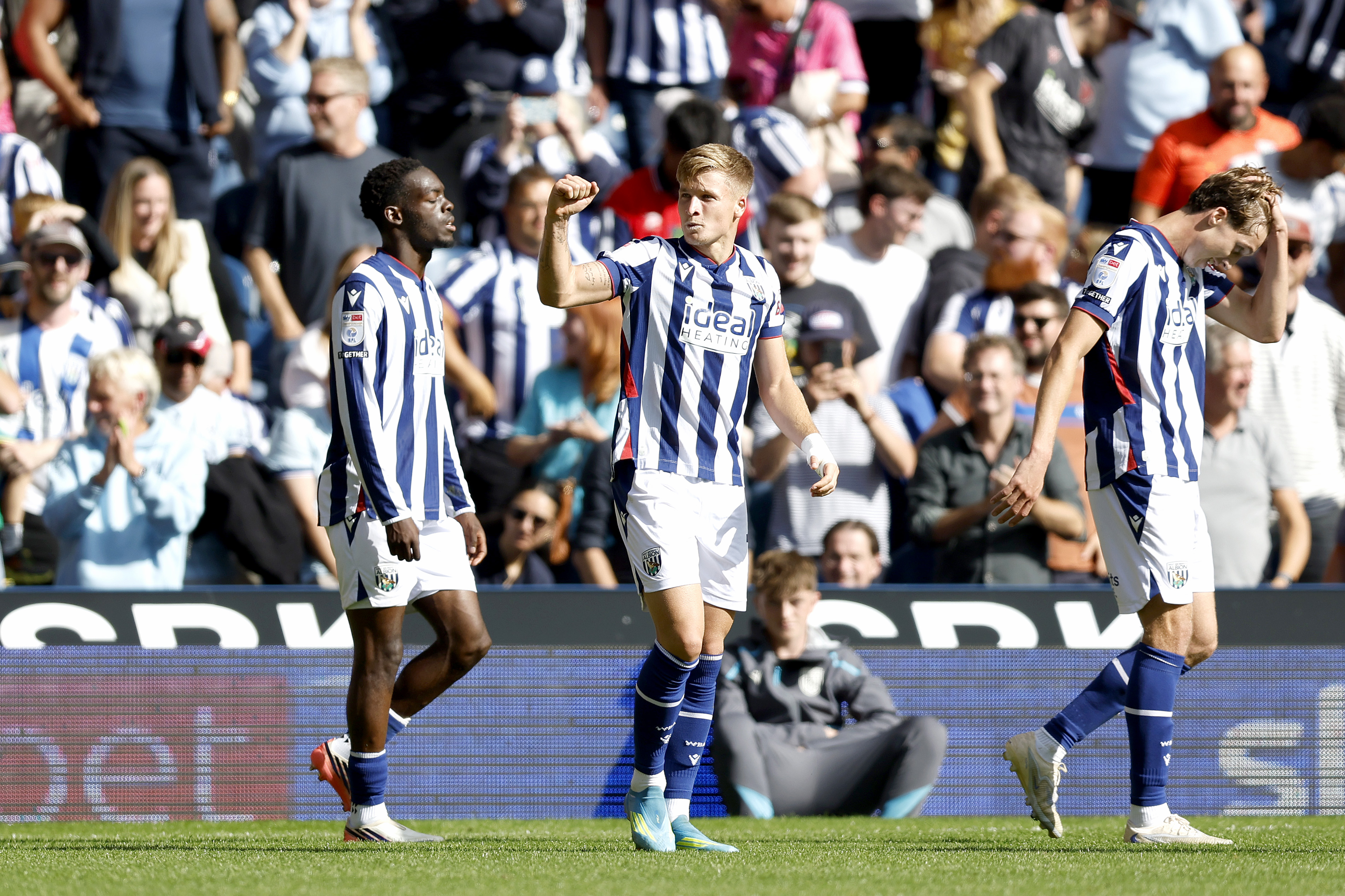 JJ Morgan celebrates scoring against Watford at The Hawthorns in the home kit 