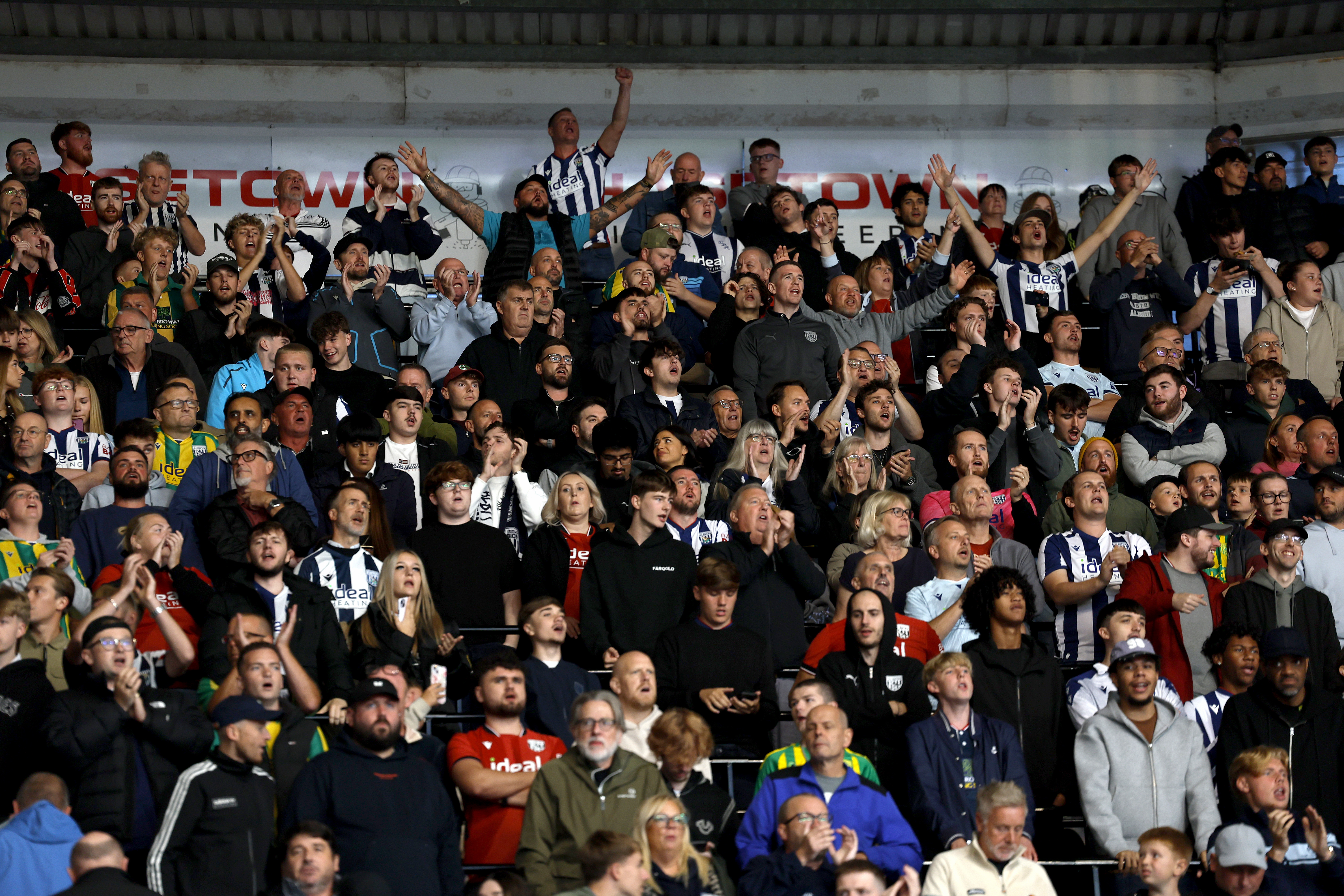 A general view of WBA fans cheering in the stand at a game