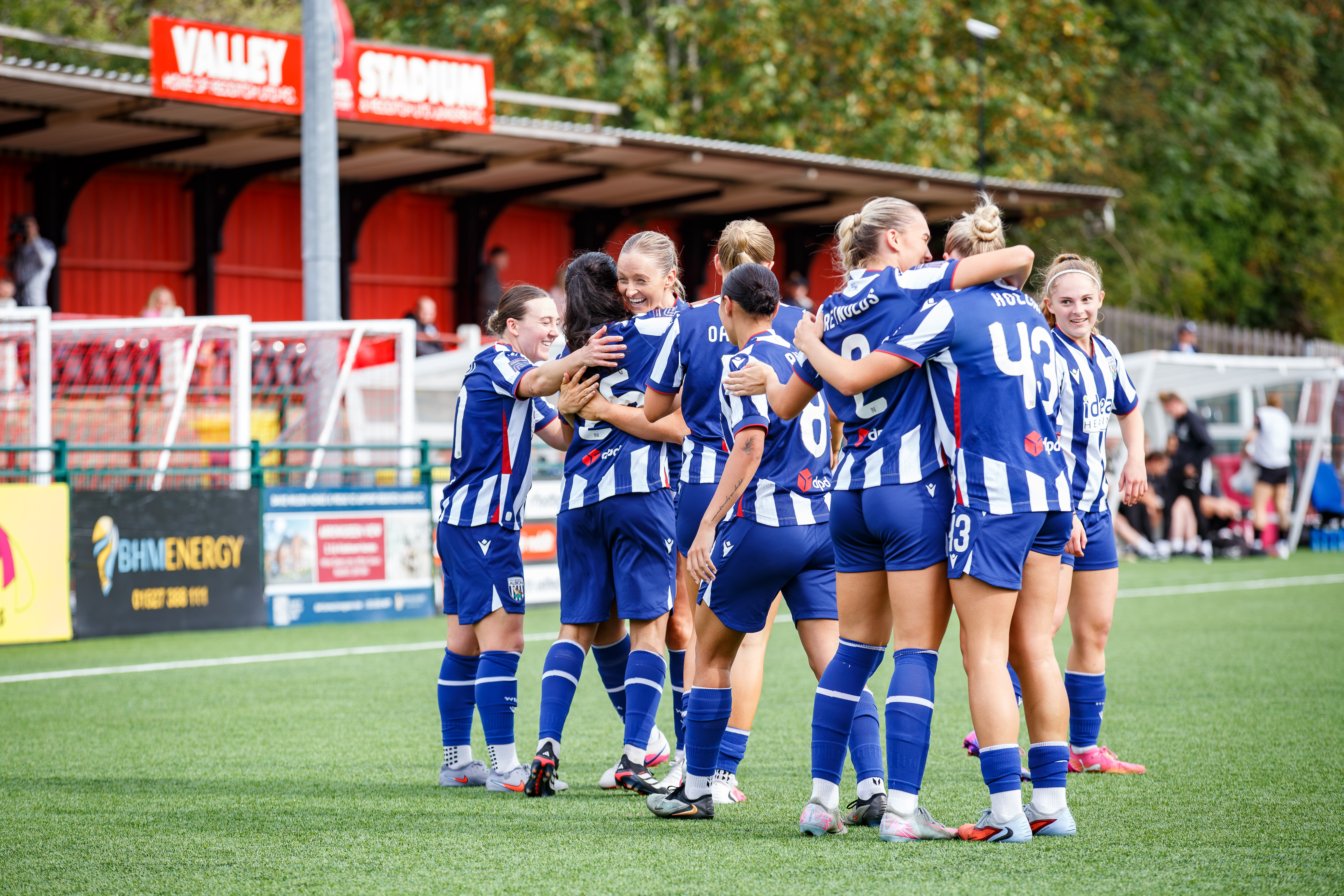 Albion Women celebrating against Peterborough United.