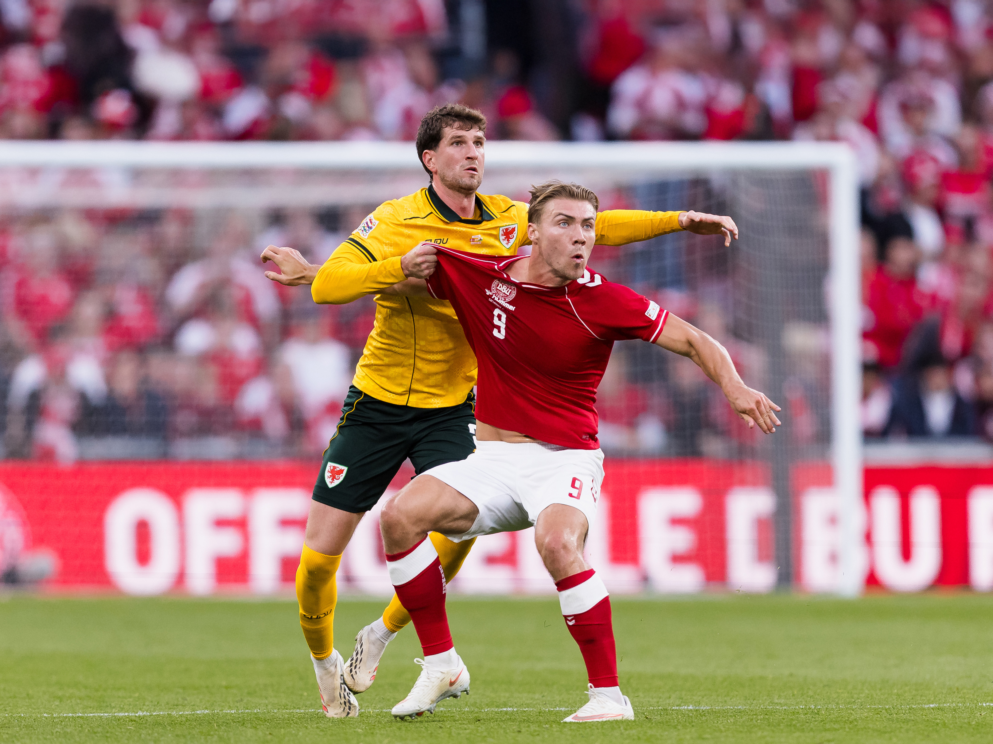 A photo of Albion defender Chris Mepham playing against Denmark for national side, Wales