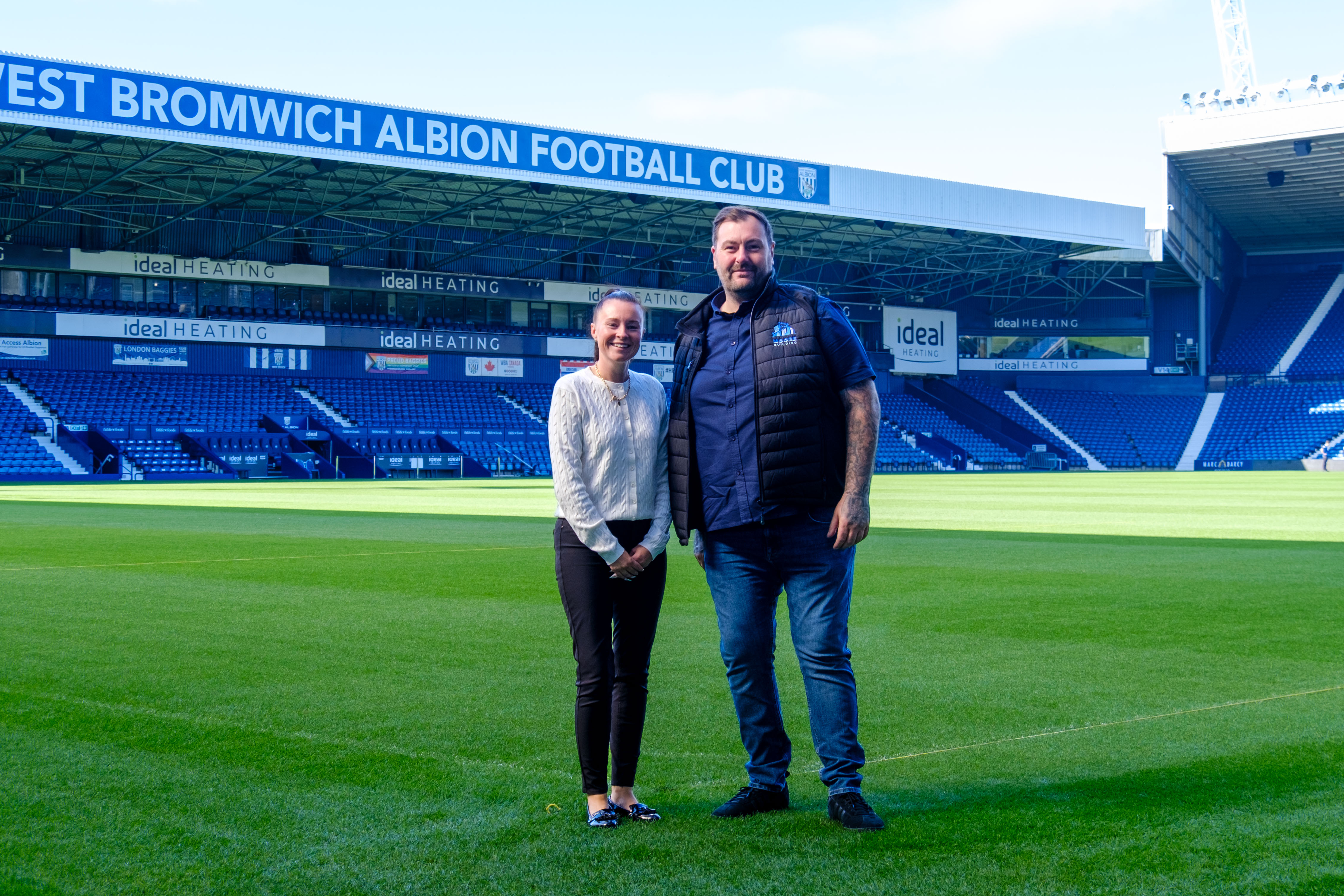 Events and Partnerships Manager Jayne Norton pitch side with Michael Moore of Moore Building LTD.