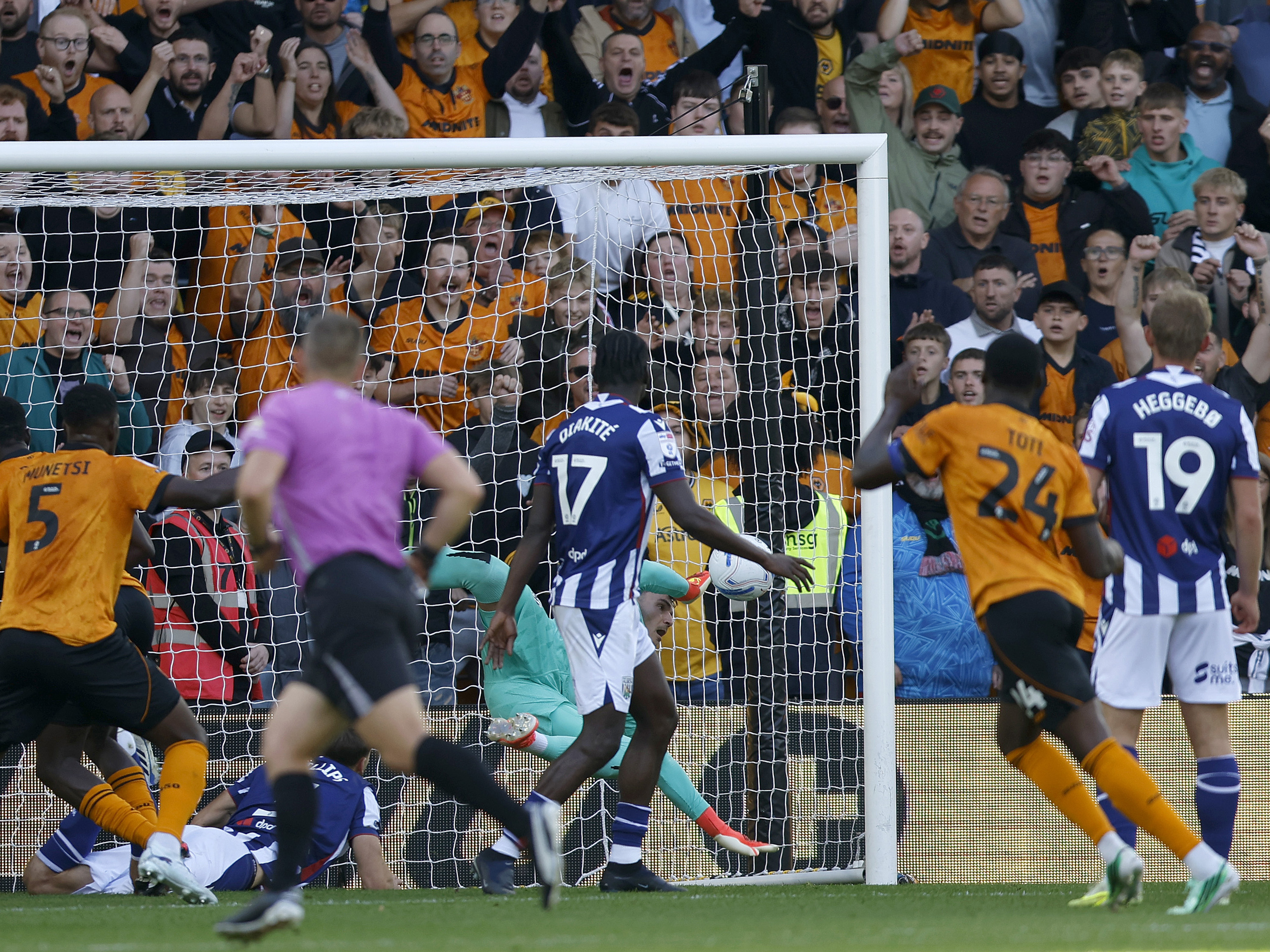 An image of Max O'Leary making a save against against Wolves