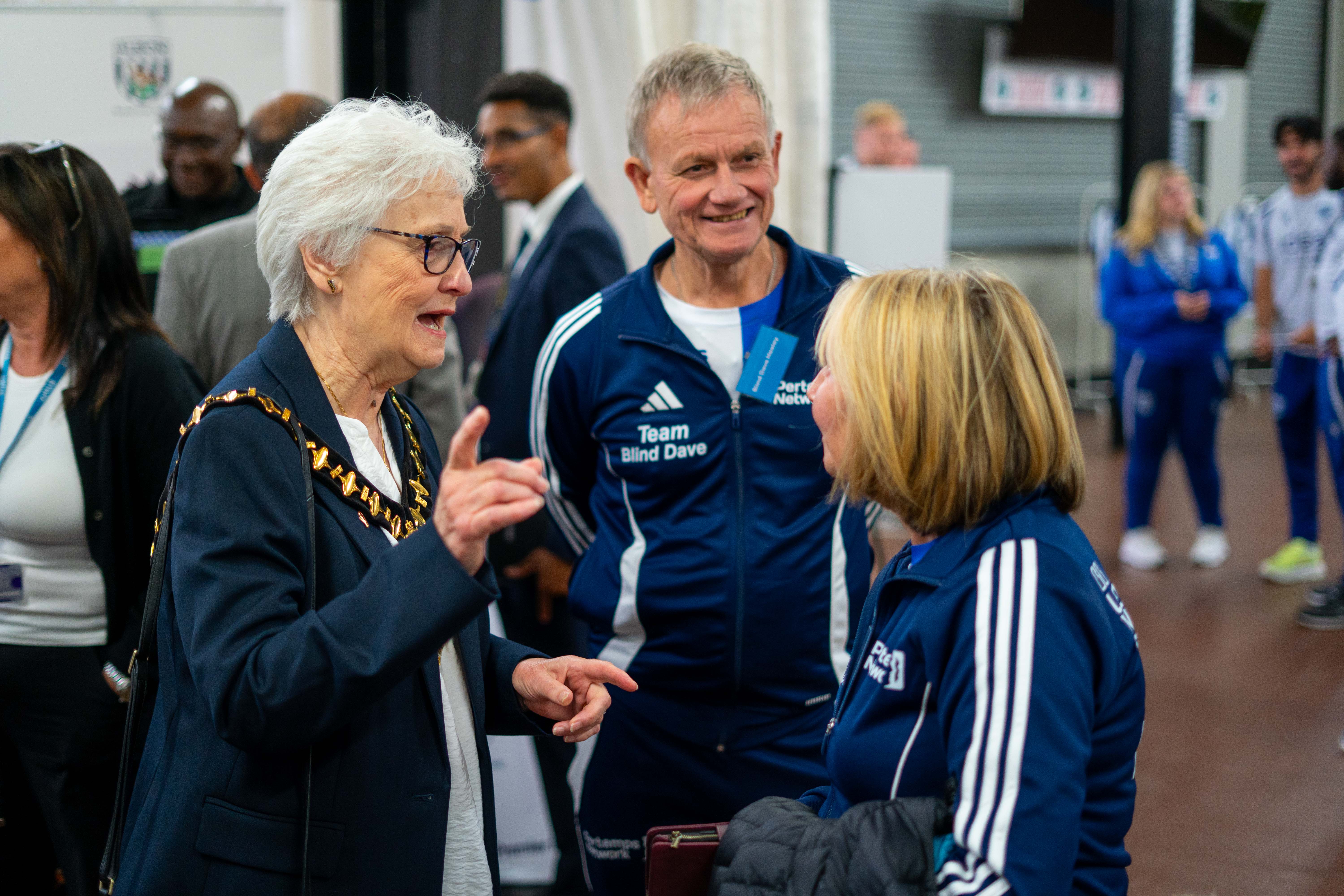 Margaret Sutton and Blind Dave greeting each other at the strategy launch