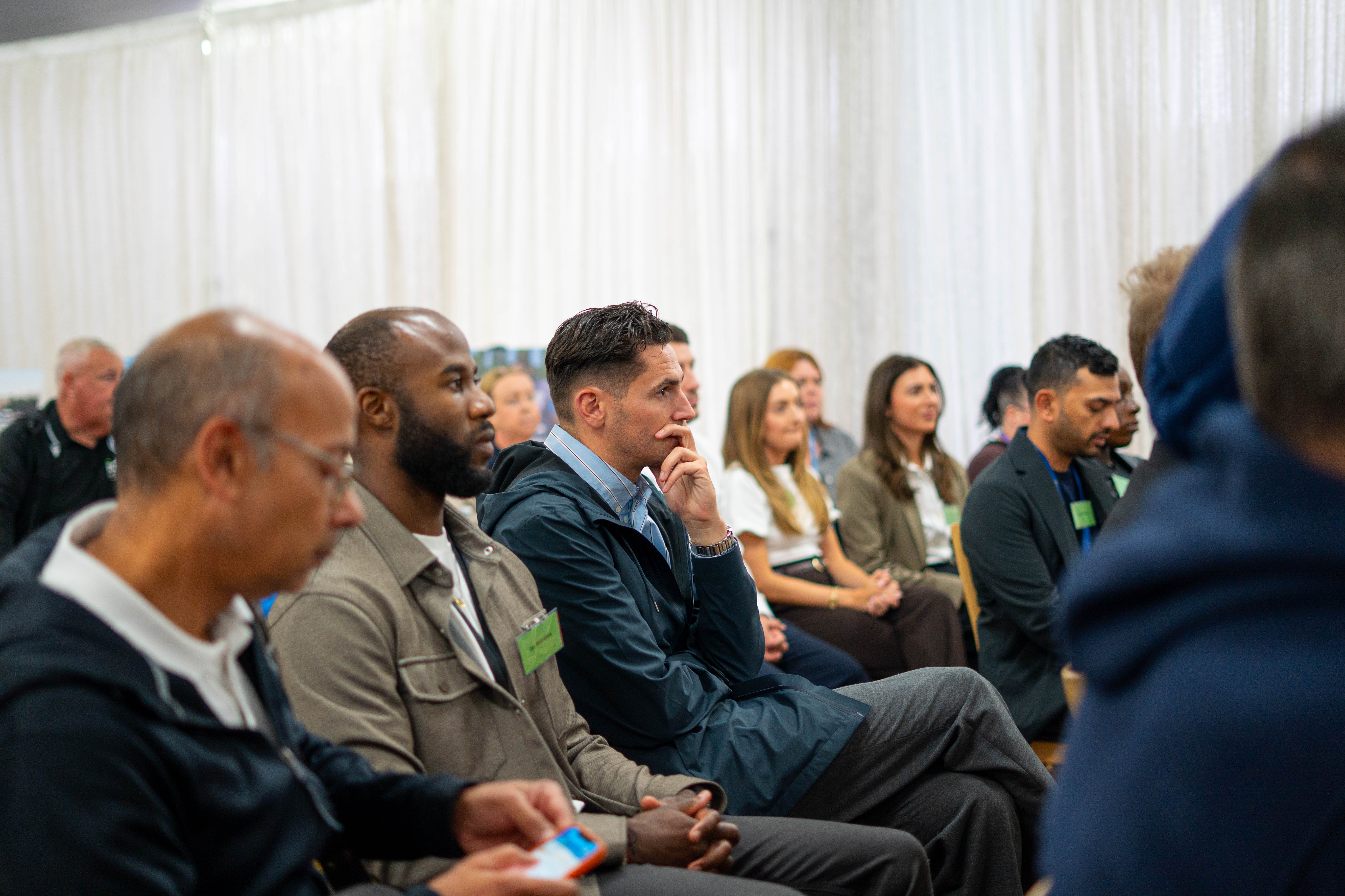 Guests listening to a panel 