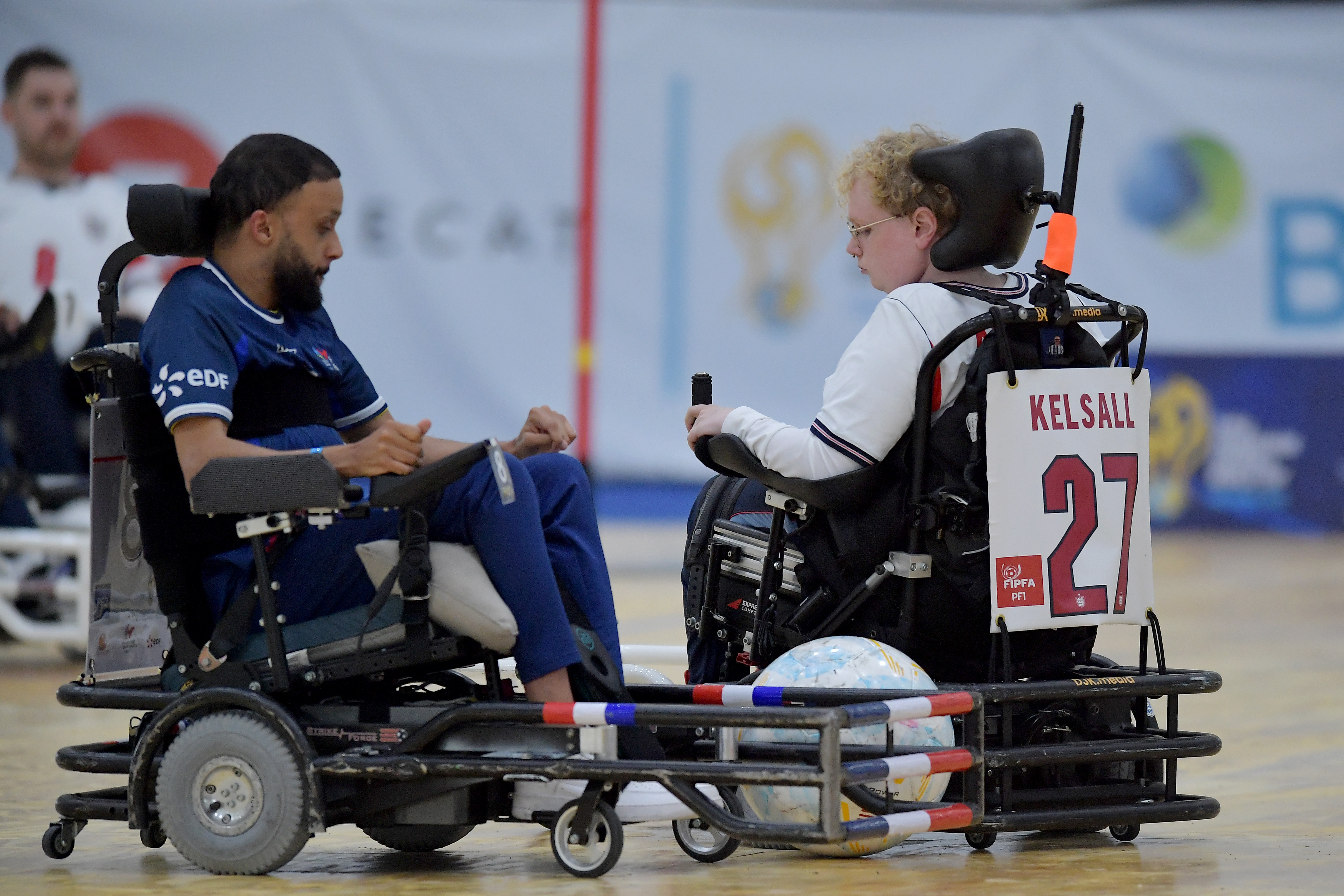 Bryan Weiss competing for the ball with England's Kelsall.