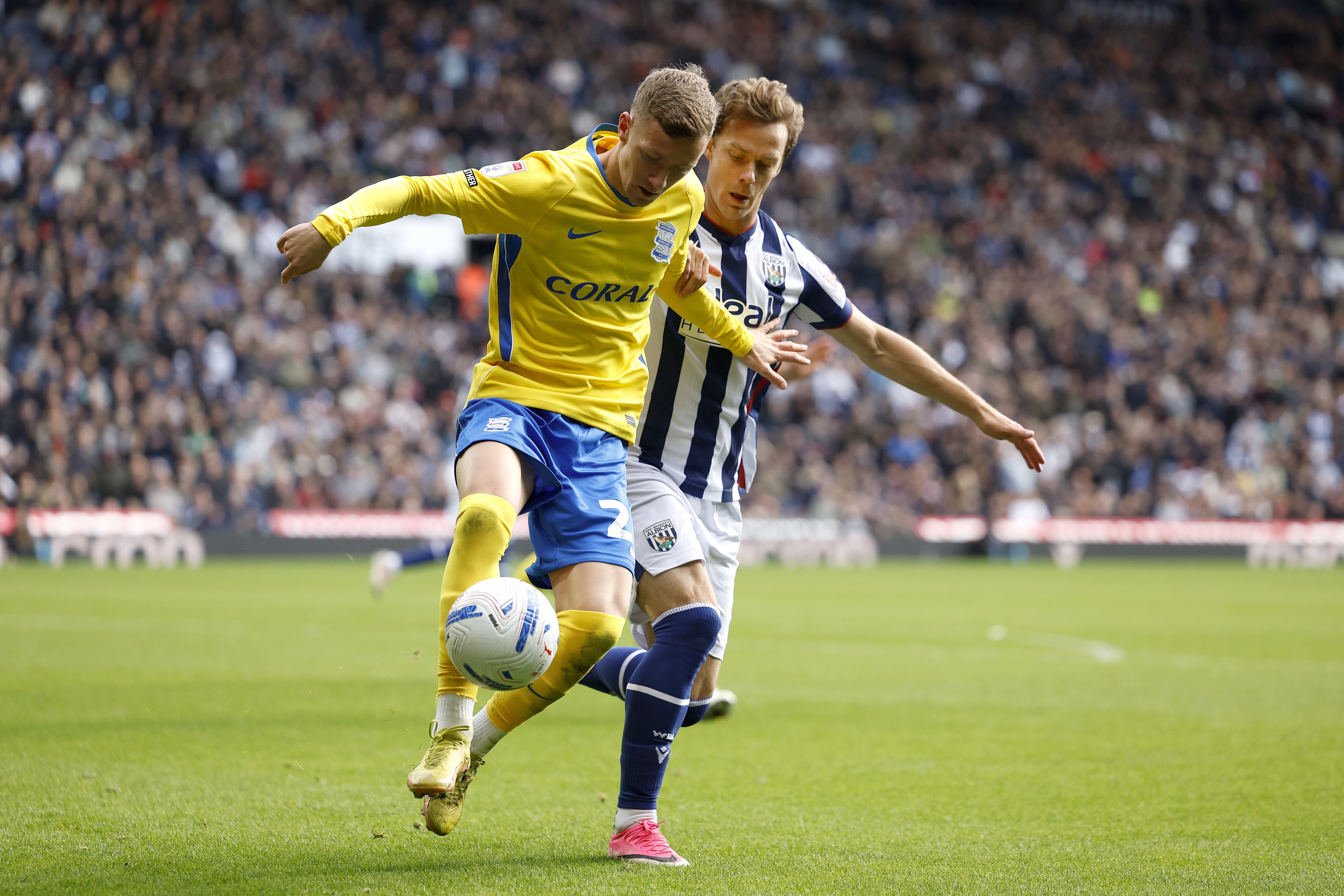 Felix Horn Myhre battling for the ball with Jay Stansfield of Birmingham
