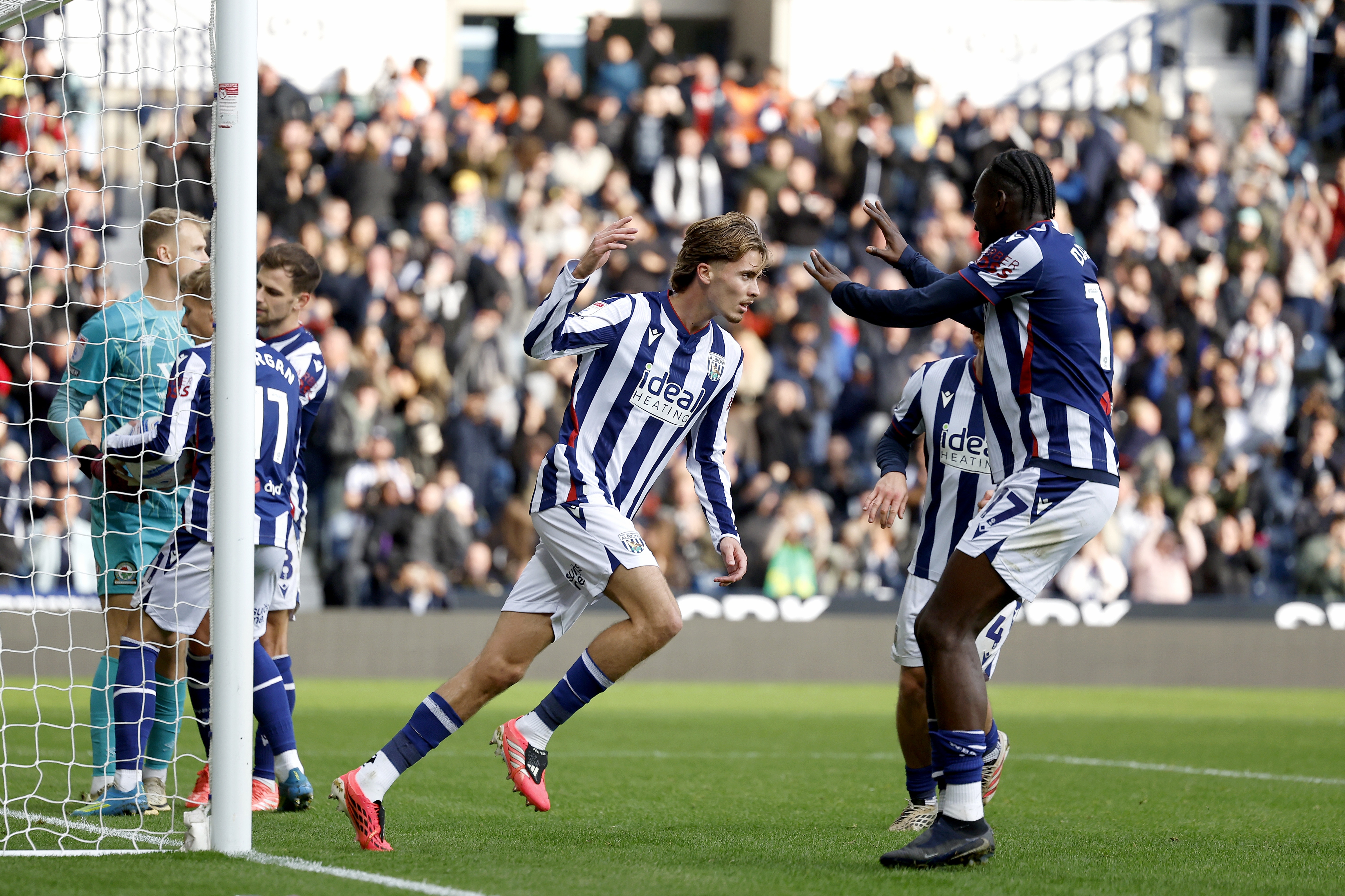 Isaac Price celebrates scoring a penalty against Blackburn