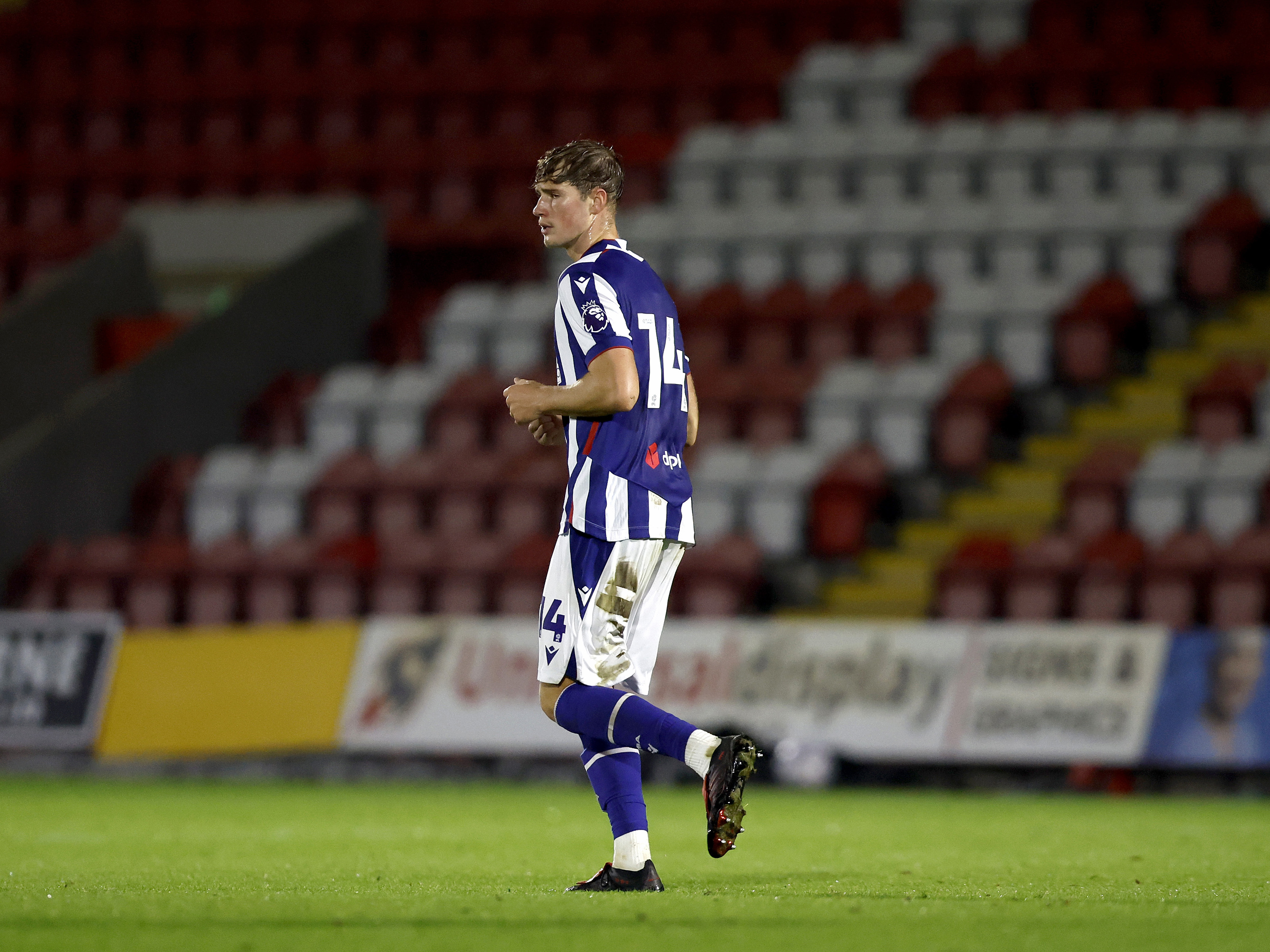A photo of young Albion defender George Shaw in the 2026/27 home kit