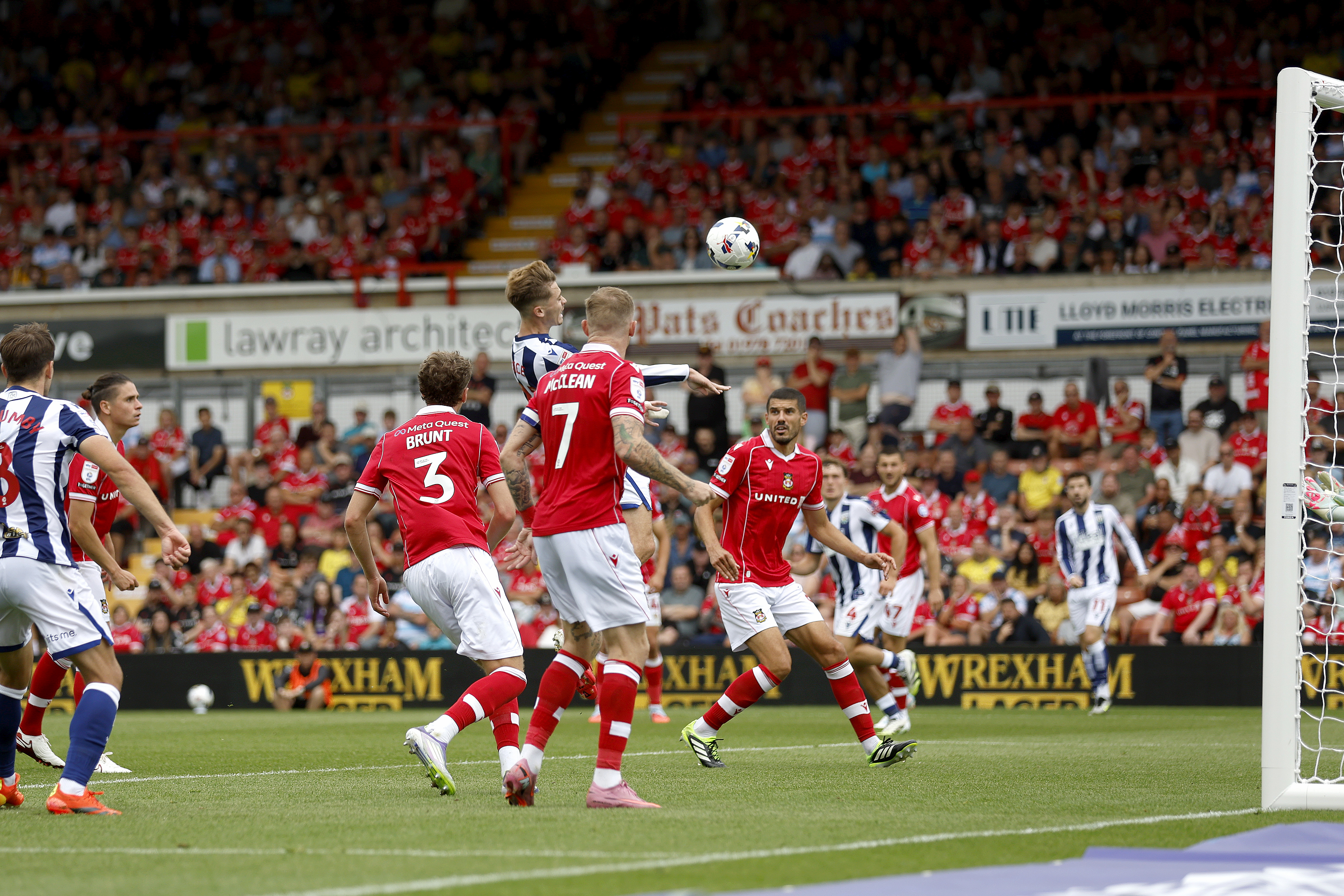Isaac Price scores a header against Wrexham in August 2025
