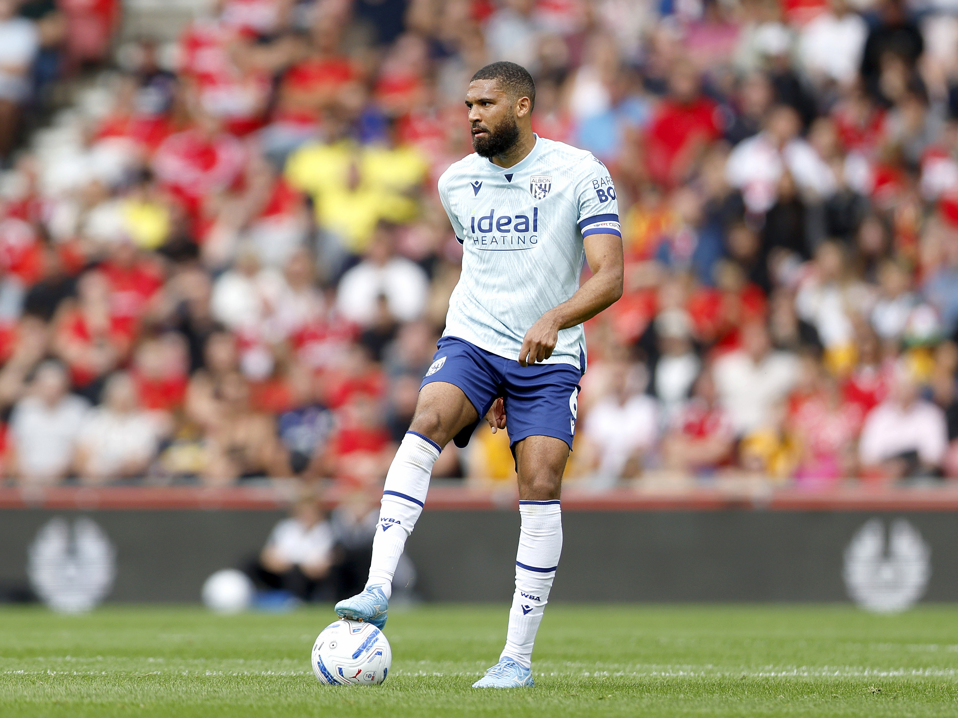 George Campbell on the ball in the blue third kit against Middlesbrough 