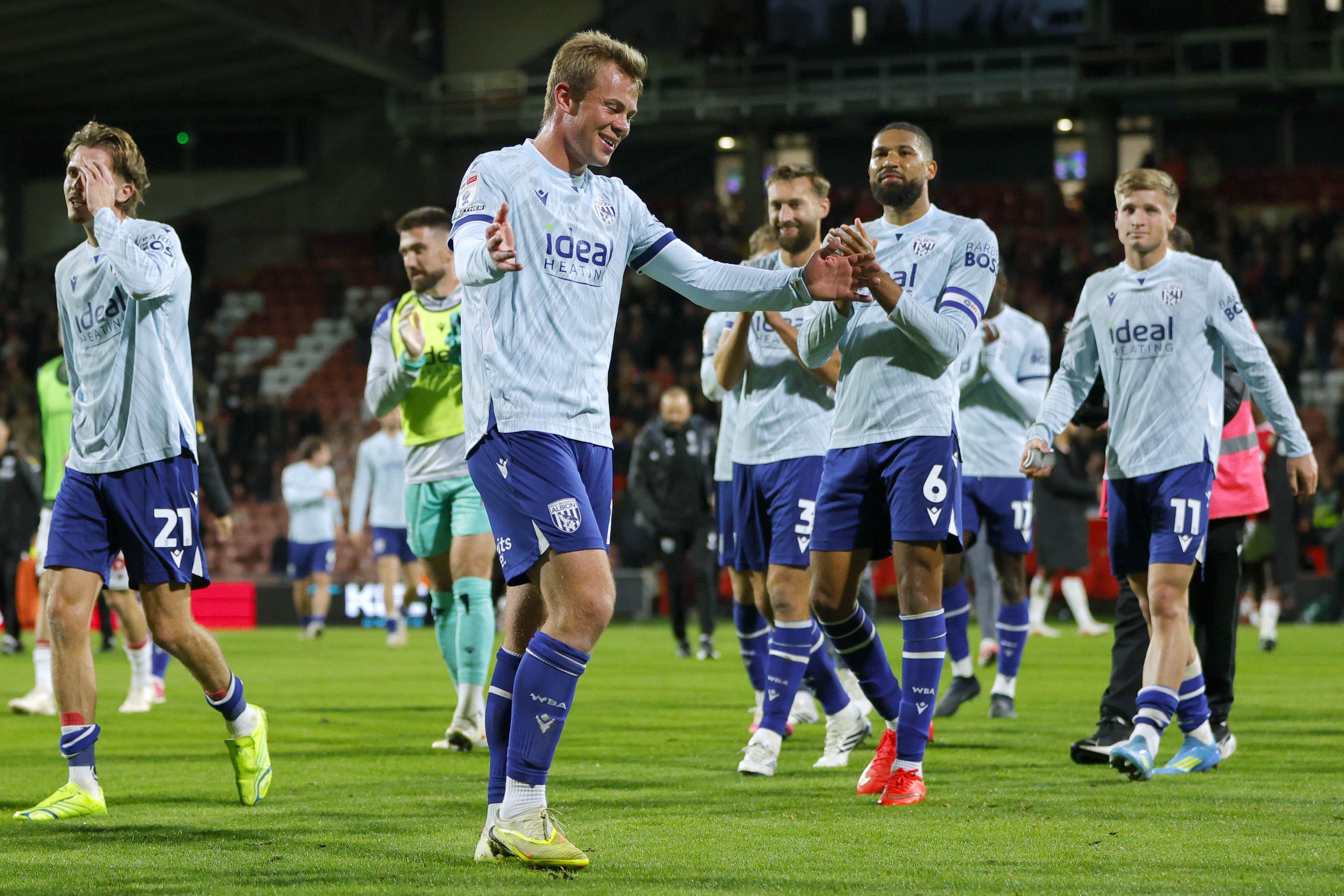Aune Heggebø celebrates at full-time after beating Wrexham in the light blue third kit 