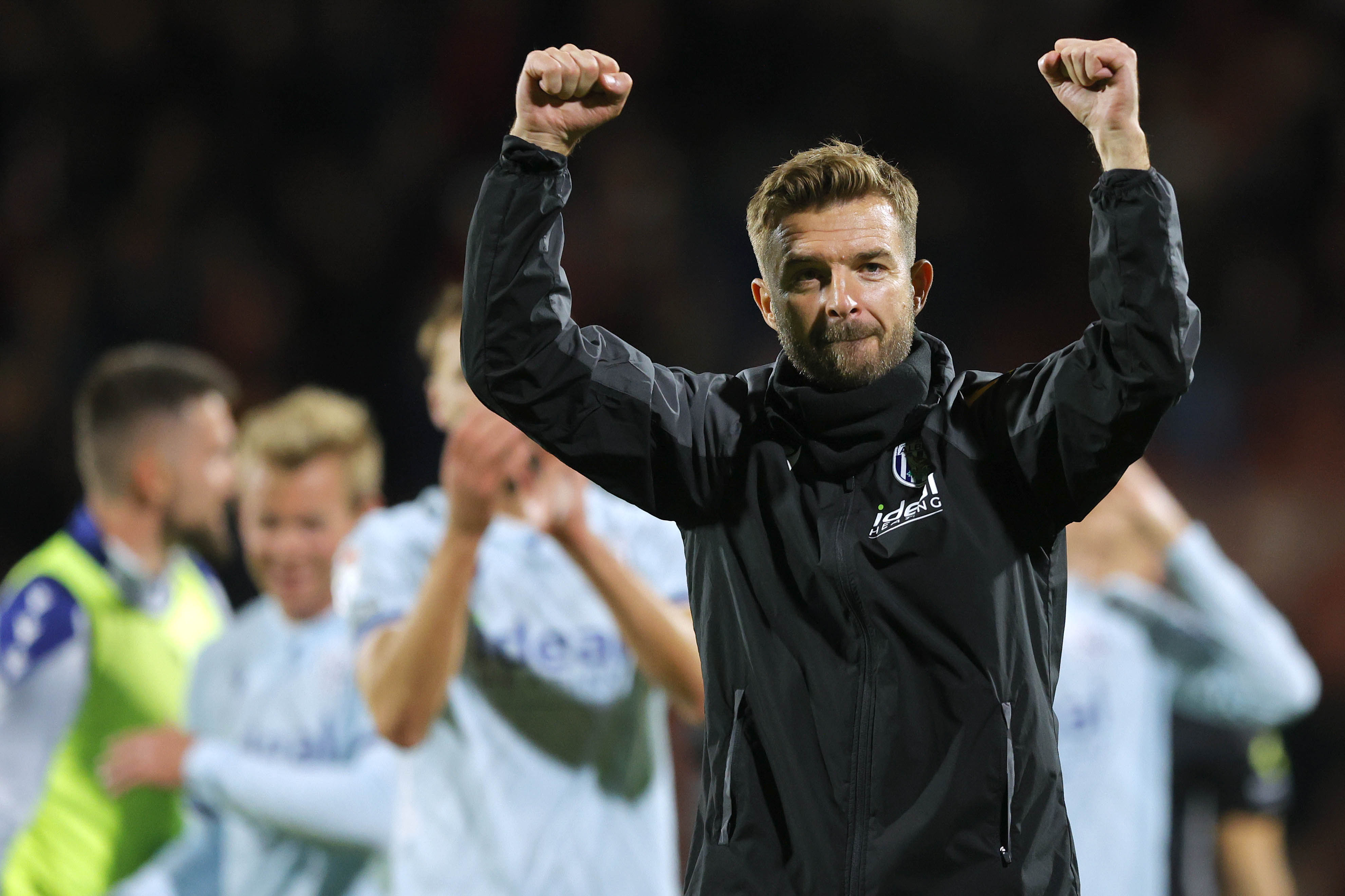 James Morrison celebrates the win over Wrexham at full-time 