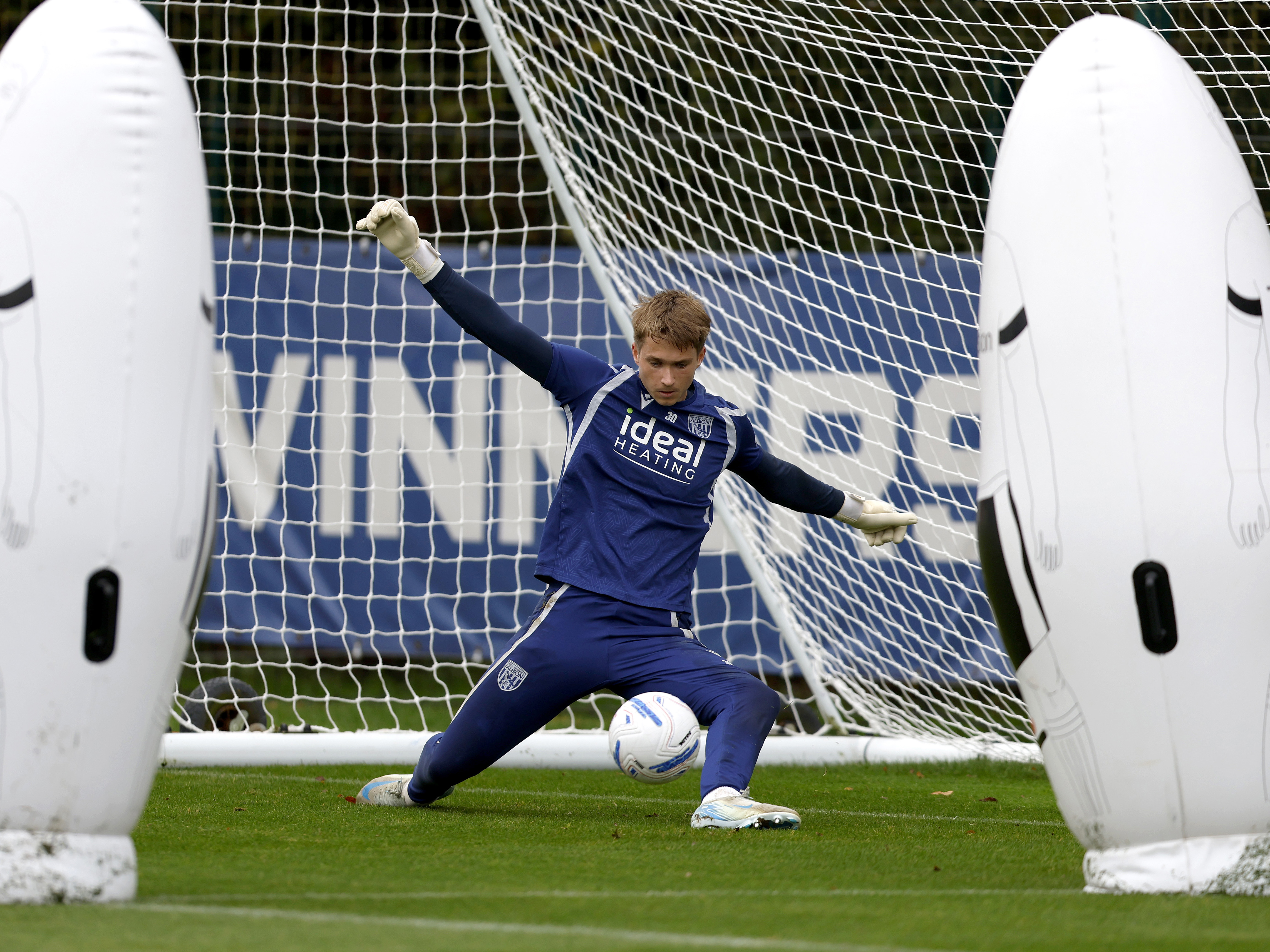 Joe Wallis making a save with his foot in training 