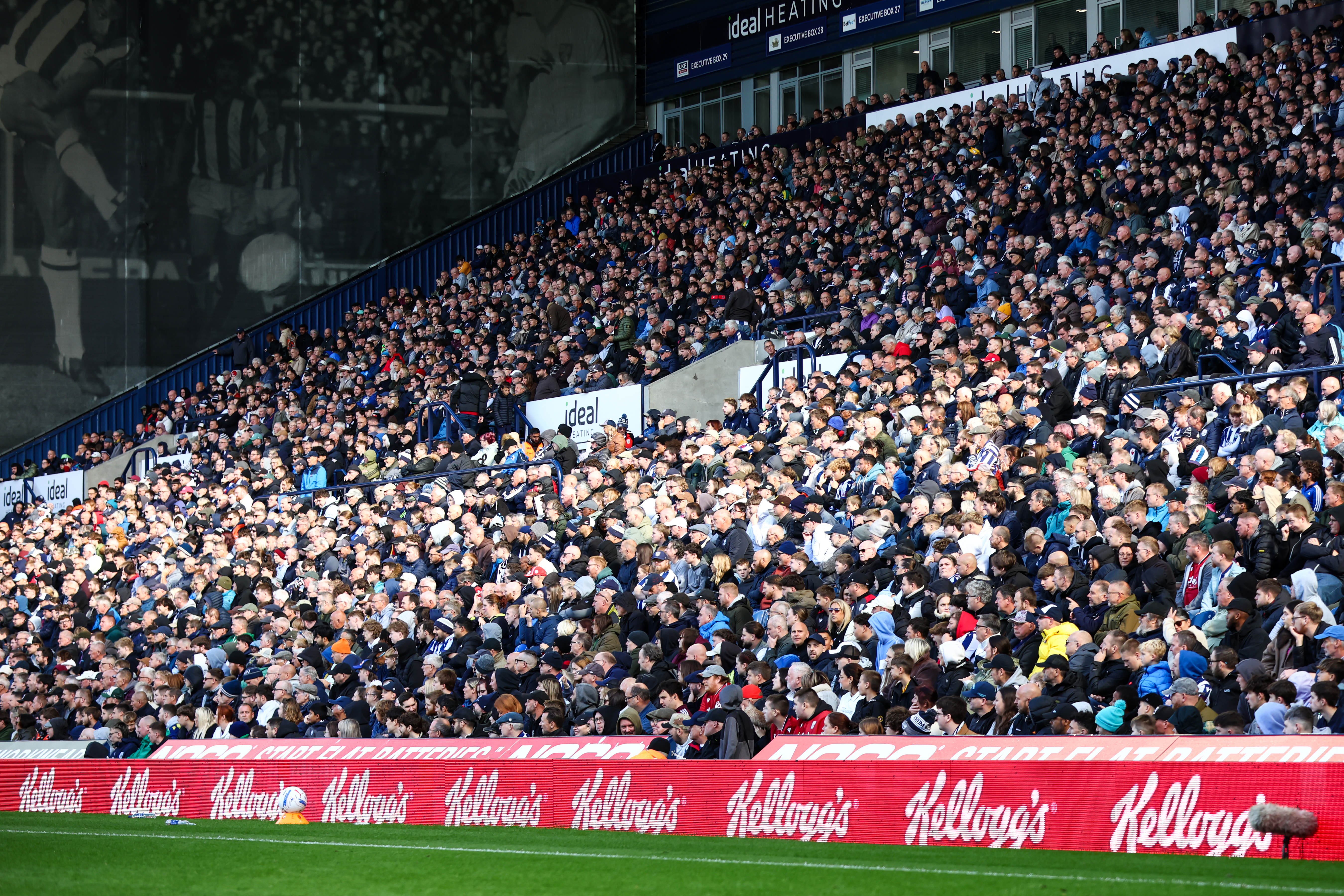 A general wide view of thousands of WBA fans in the East Stand watching a game