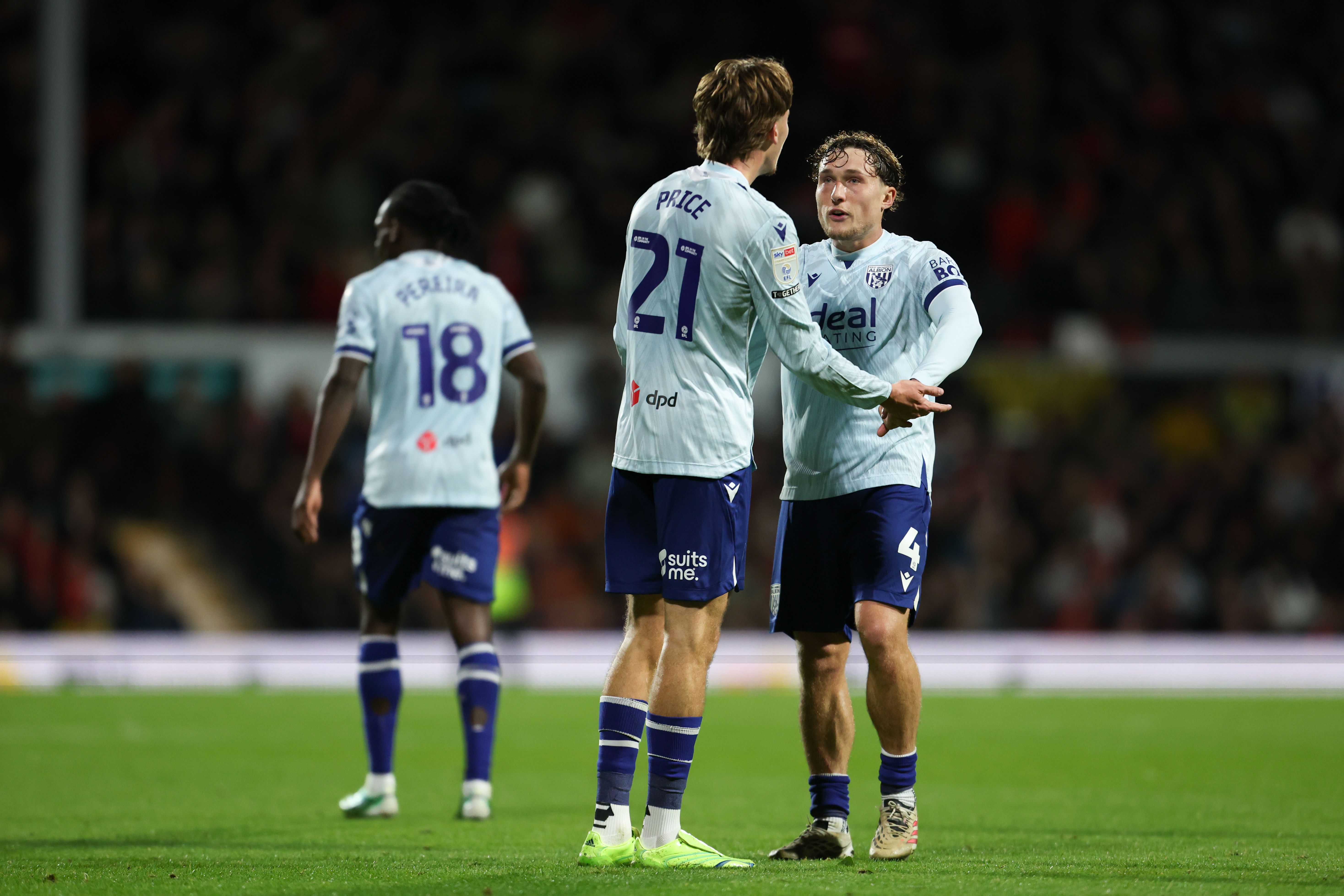 Callum Styles and Isaac Price celebrate Price's goal against Wrexham