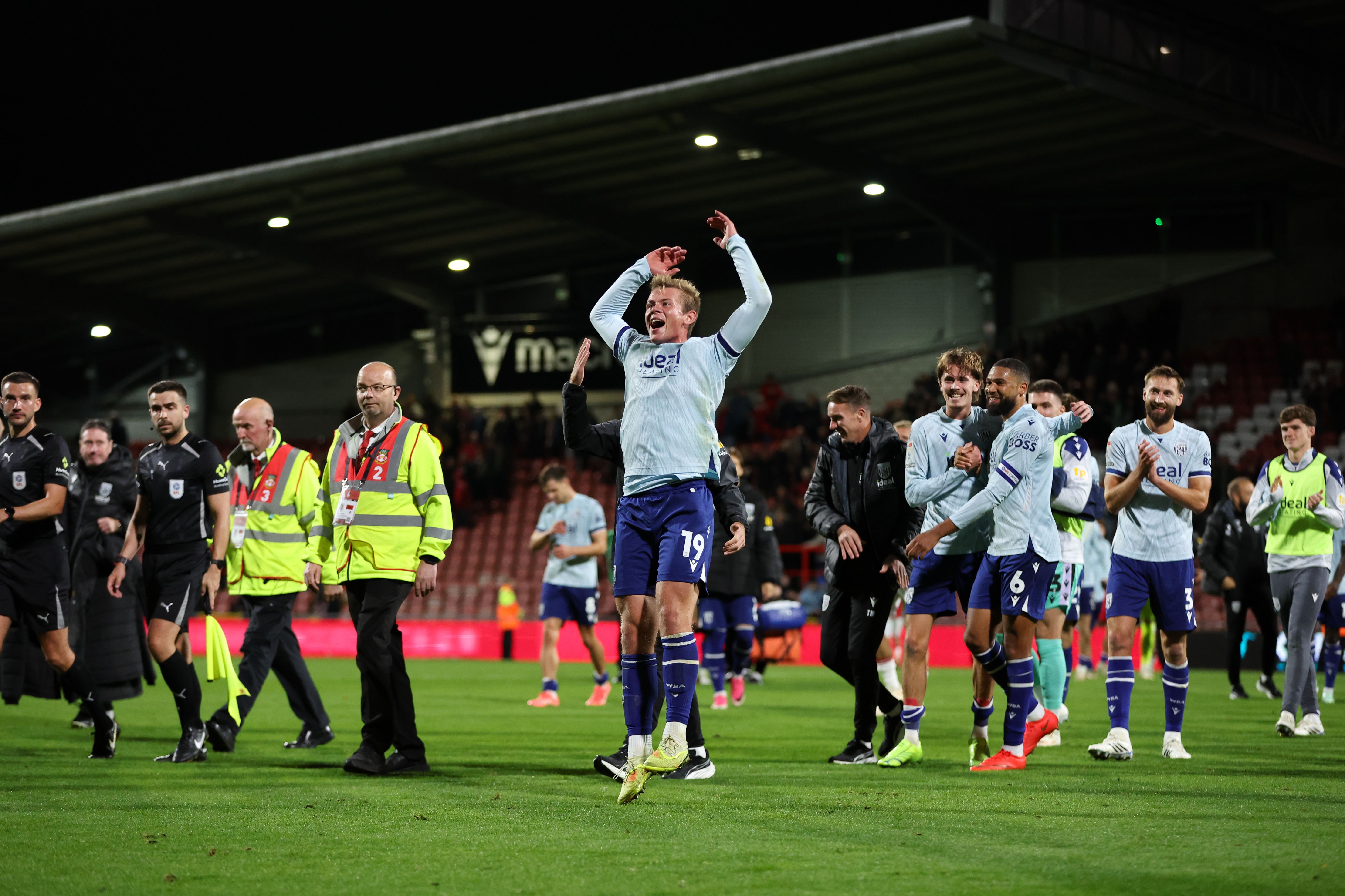 Aune Heggebø celebrates with Albion fans after the win at Wrexham 