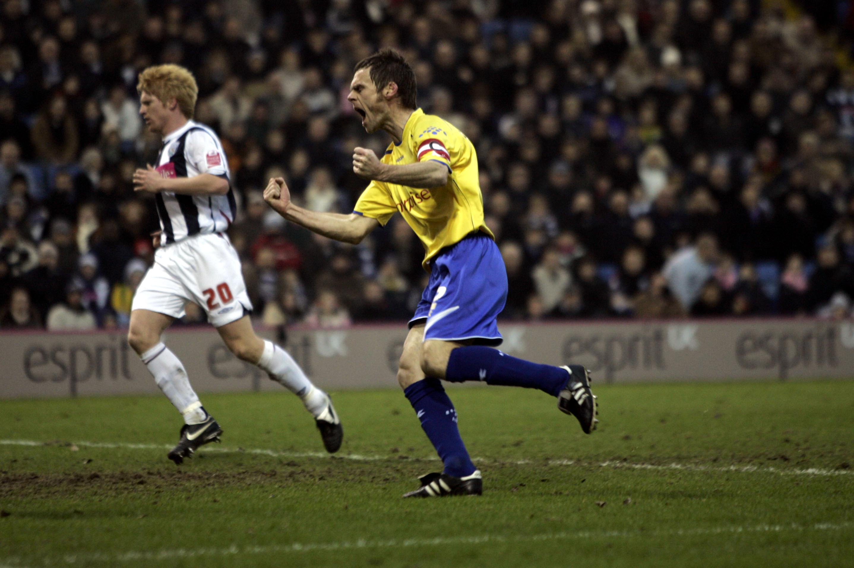 Graham Alexander celebrates scoring a penalty for Preston against Albion