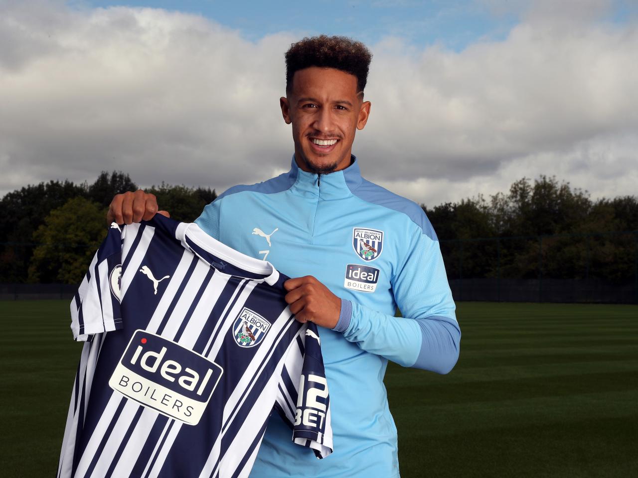 Callum Robinson poses for pictures after joining the Baggies permanently