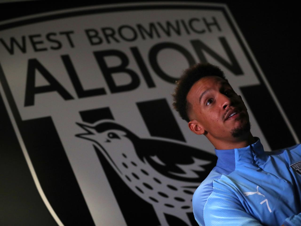 Callum Robinson poses for pictures after joining the Baggies permanently