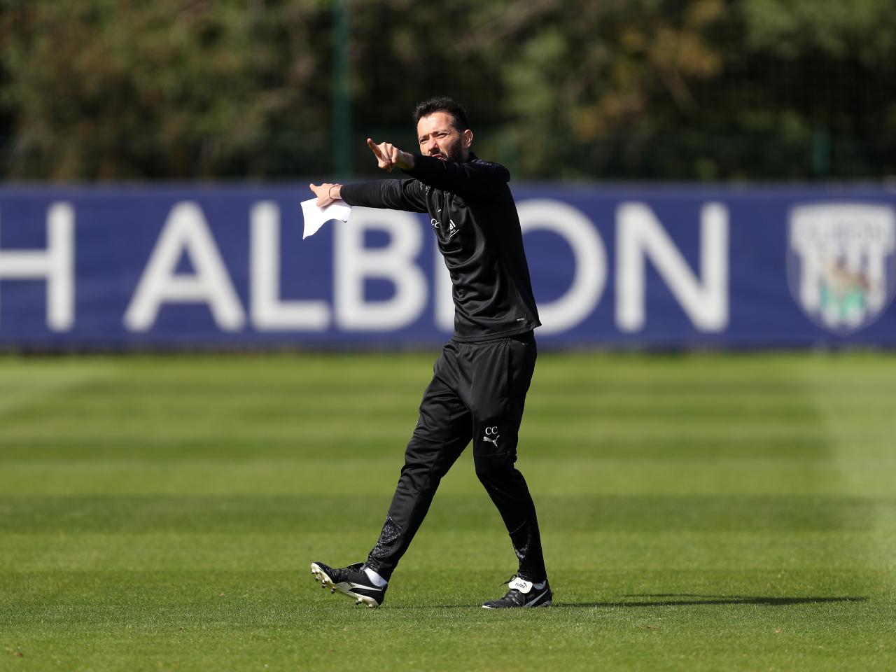 Carlos Corberán watching over training 