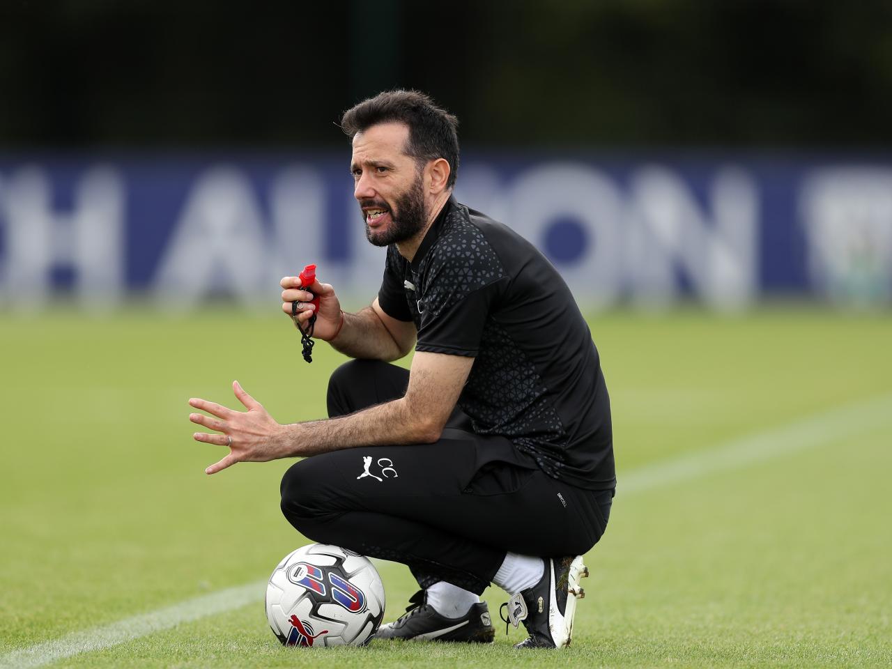 Carlos Corberán watching over training 