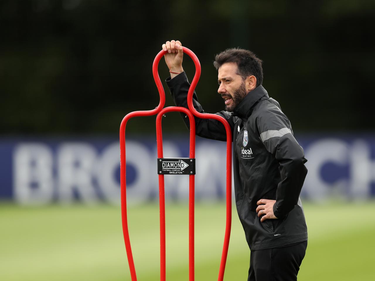 Carlos Corberán watching training 