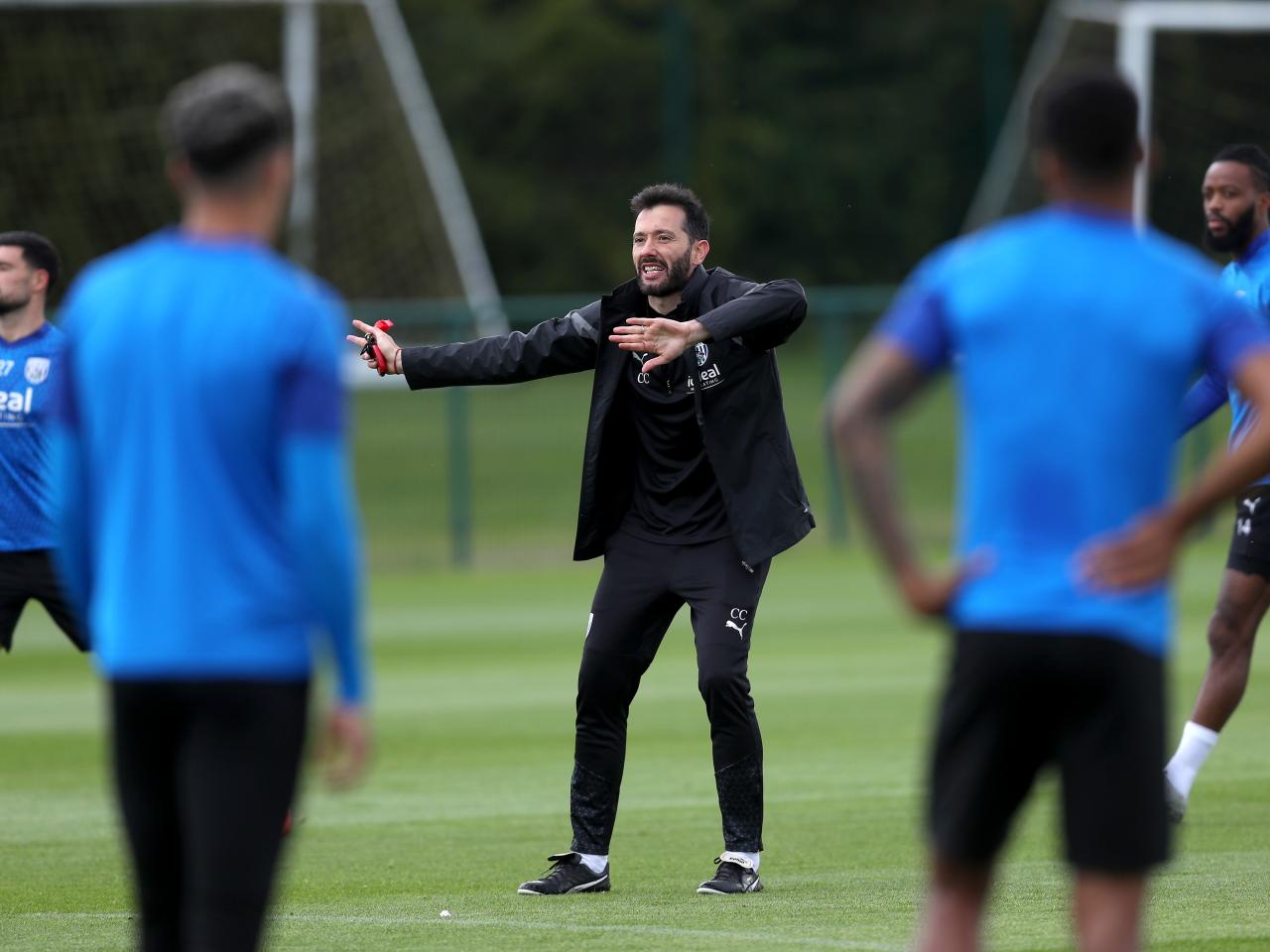 Carlos Corberán coaching the players on the training pitch