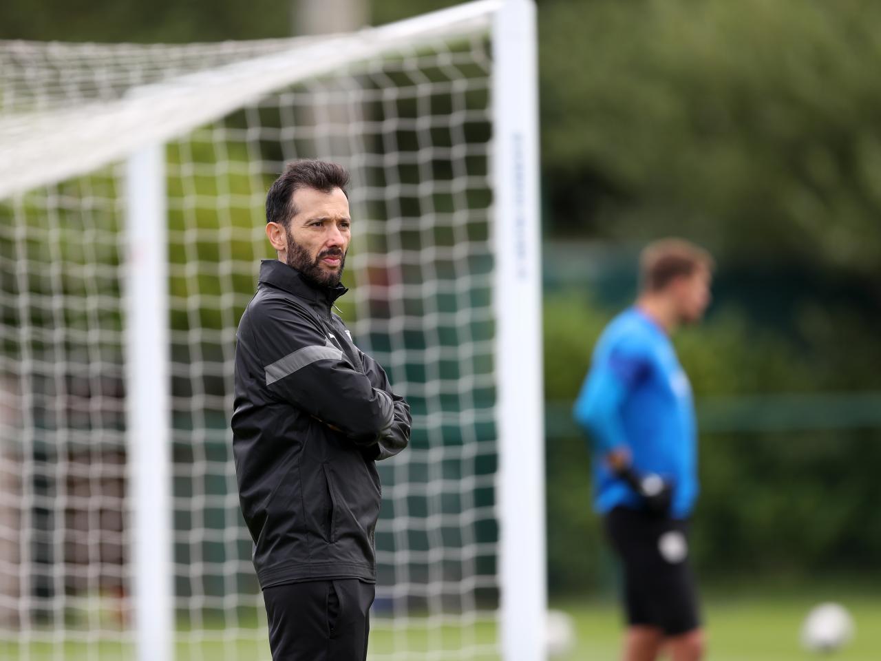 Carlos Corberán watching training 