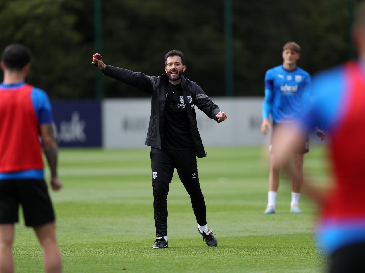 Carlos Corberán coaching the players on the training pitch
