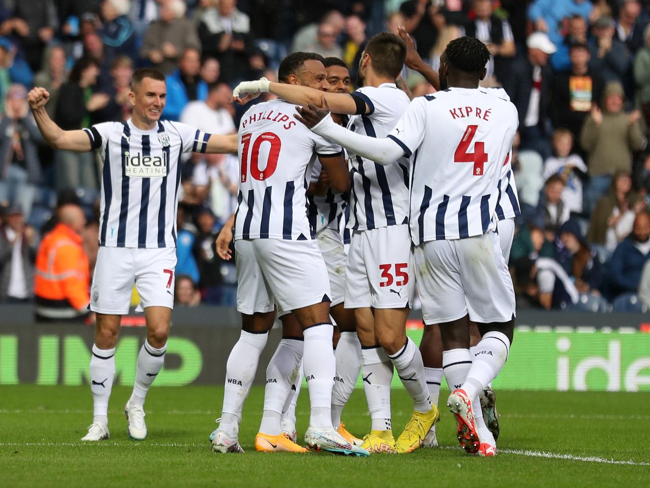 Albion players celebrate their second goal against Swansea 