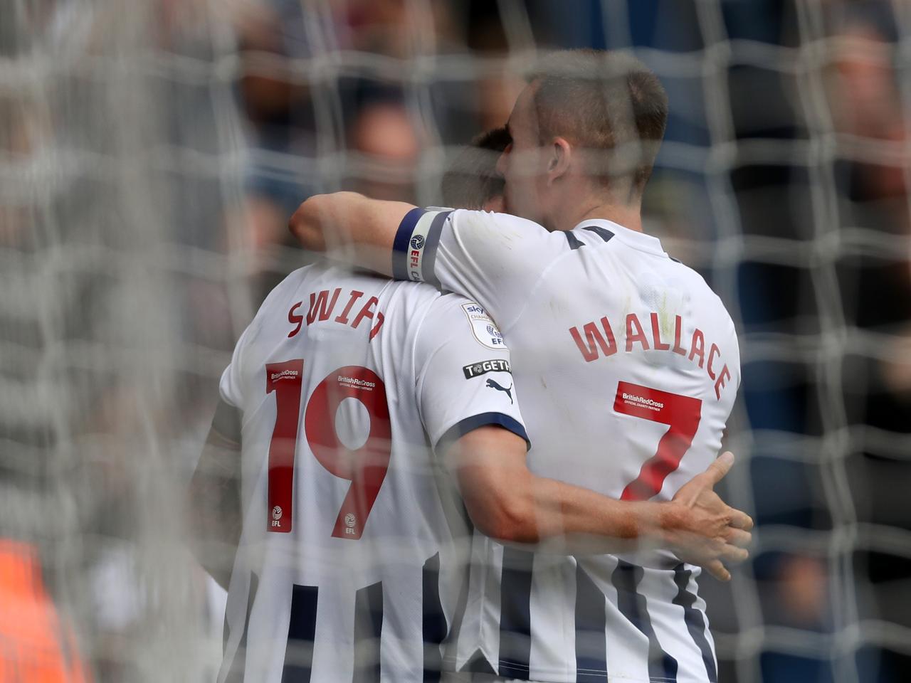 John Swift celebrates scoring against Swansea with Jed Wallace