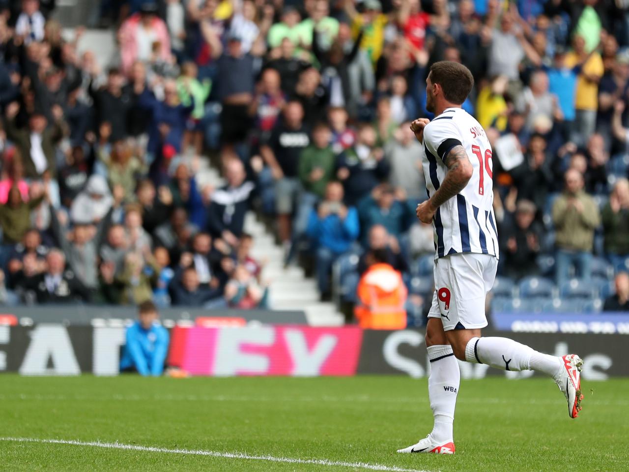 John Swift celebrates scoring against Swansea 