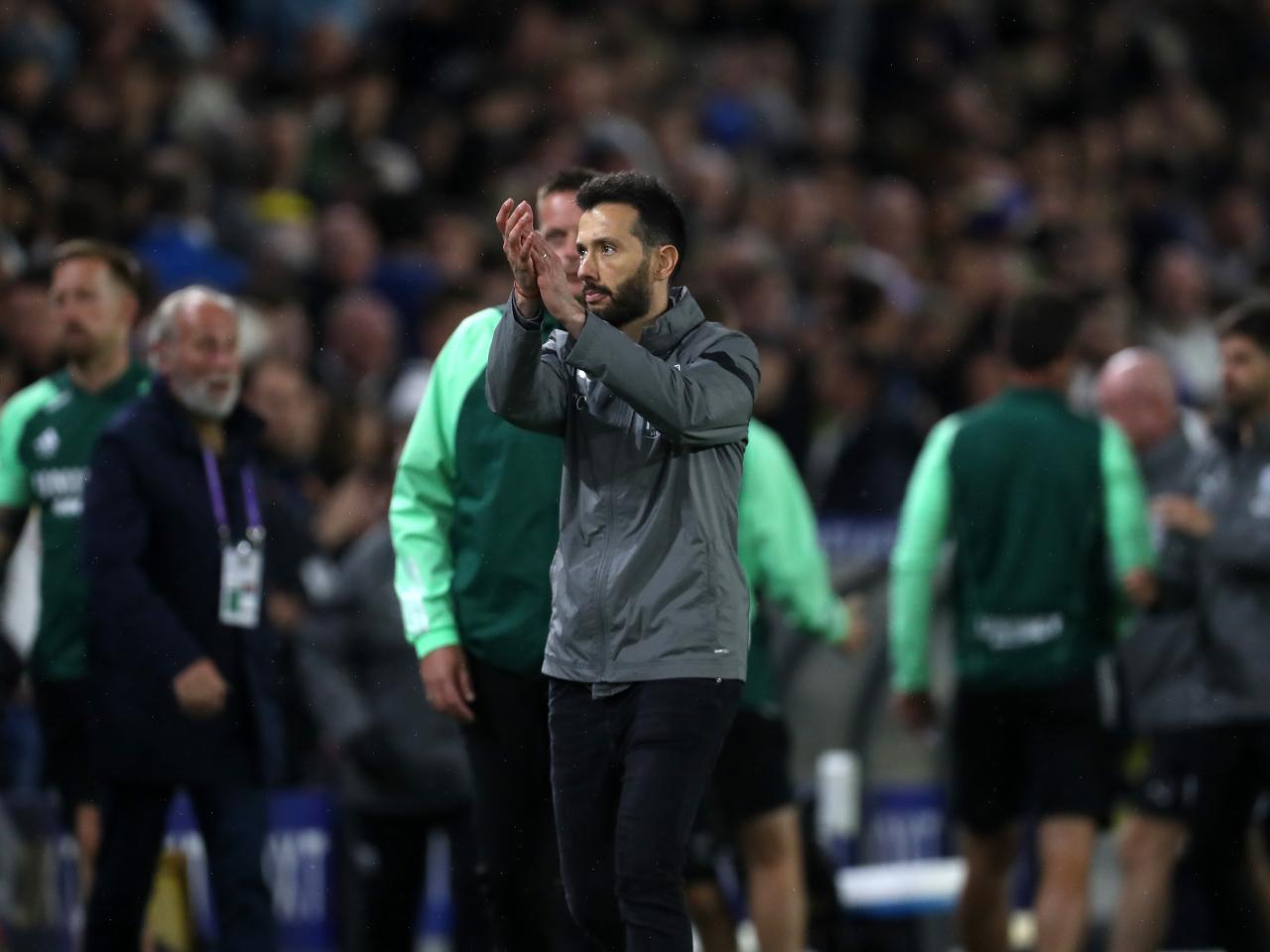Carlos Corberán applauds the away fans at Elland Road