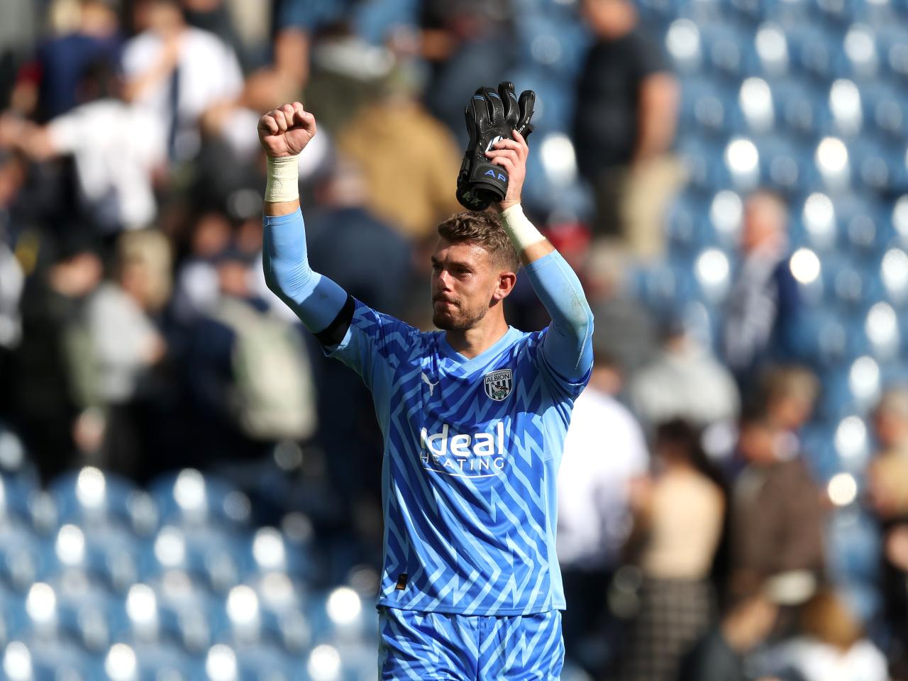 Alex Palmer applauds the fans at full time