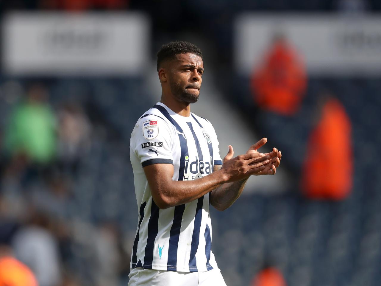 Darnell Furlong applauds the fans at full time