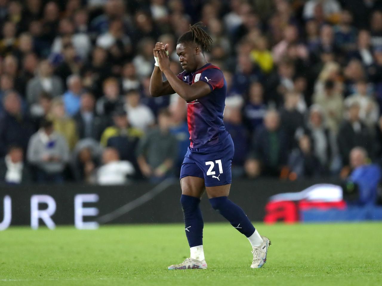 Brandon Thomas-Asante applauds the away fans at Elland Road