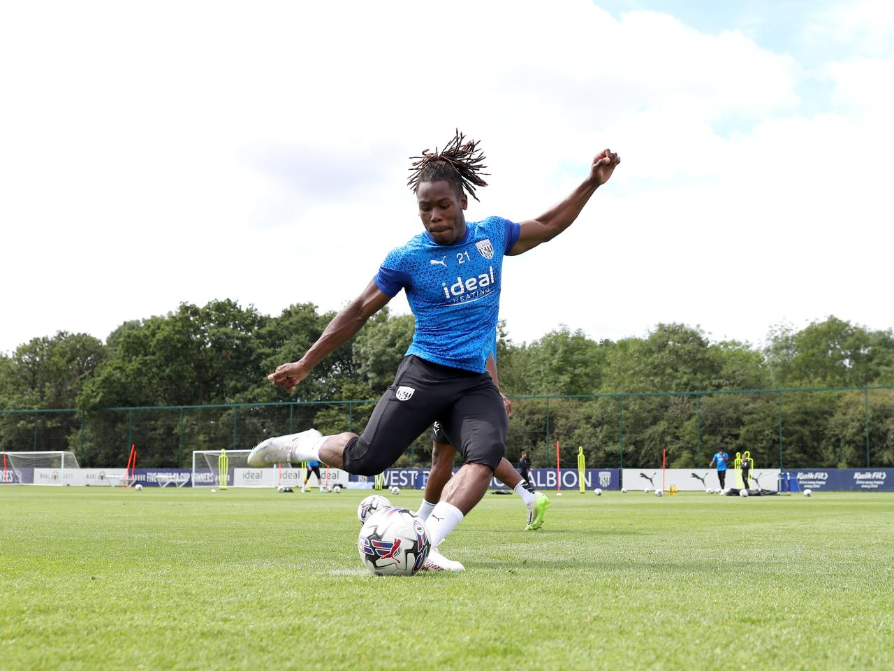 Brandon Thomas-Asante strikes the ball in training 